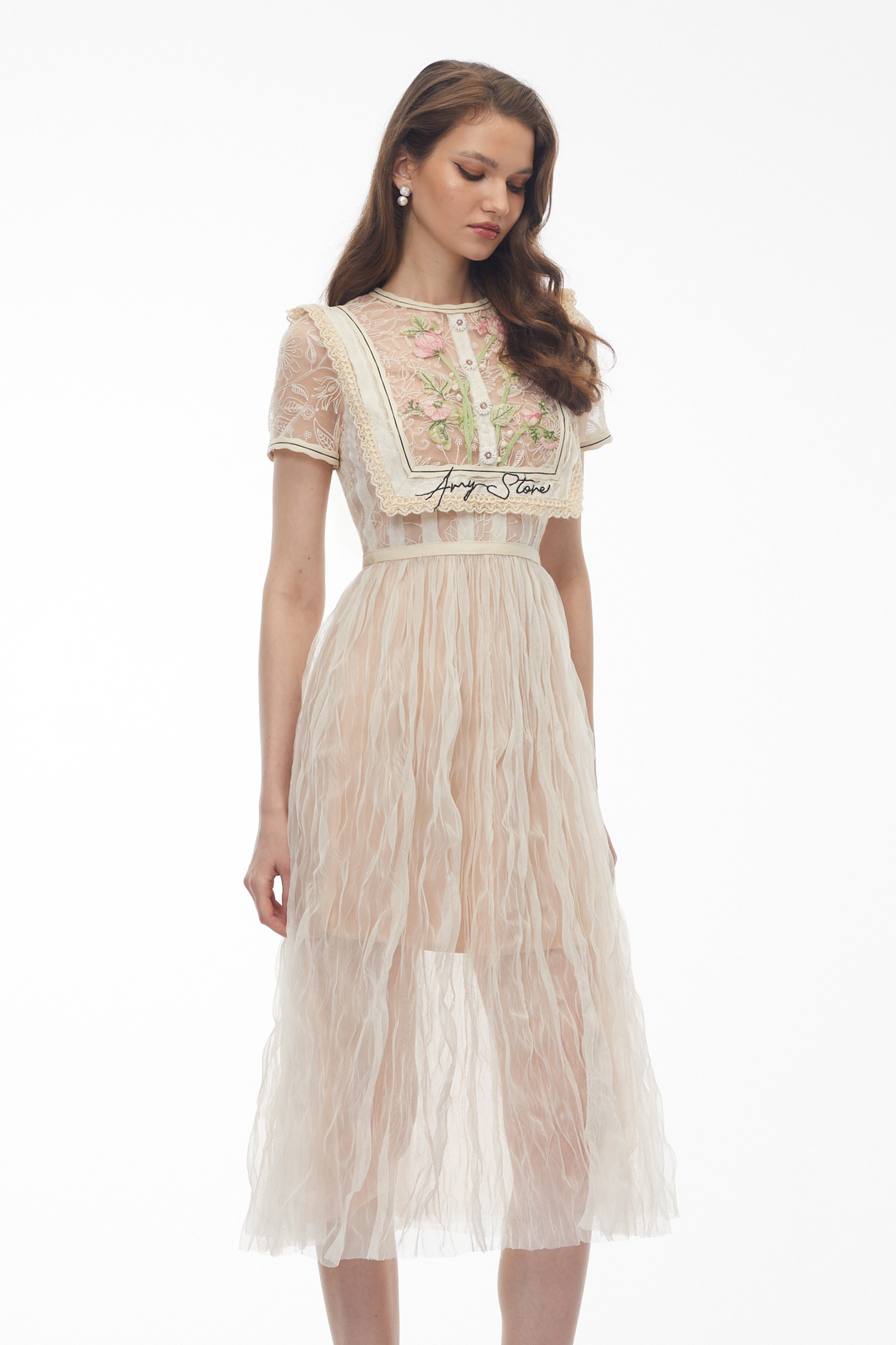 Beige lace midi dress with floral embroidery and bib detail