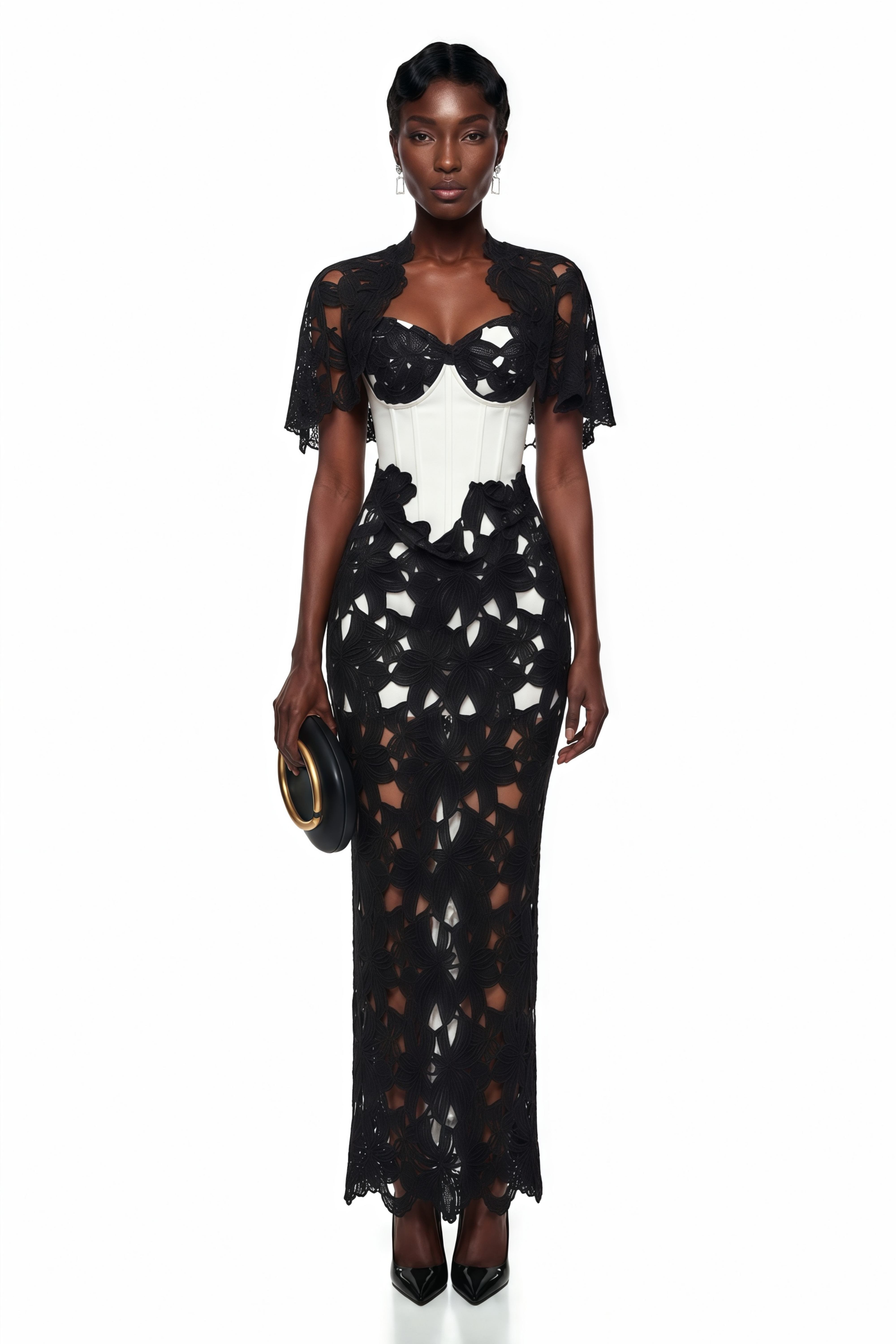 Black and white maxi dress with a cutout lace overlay, white corset bodice, and matching caplet shrug