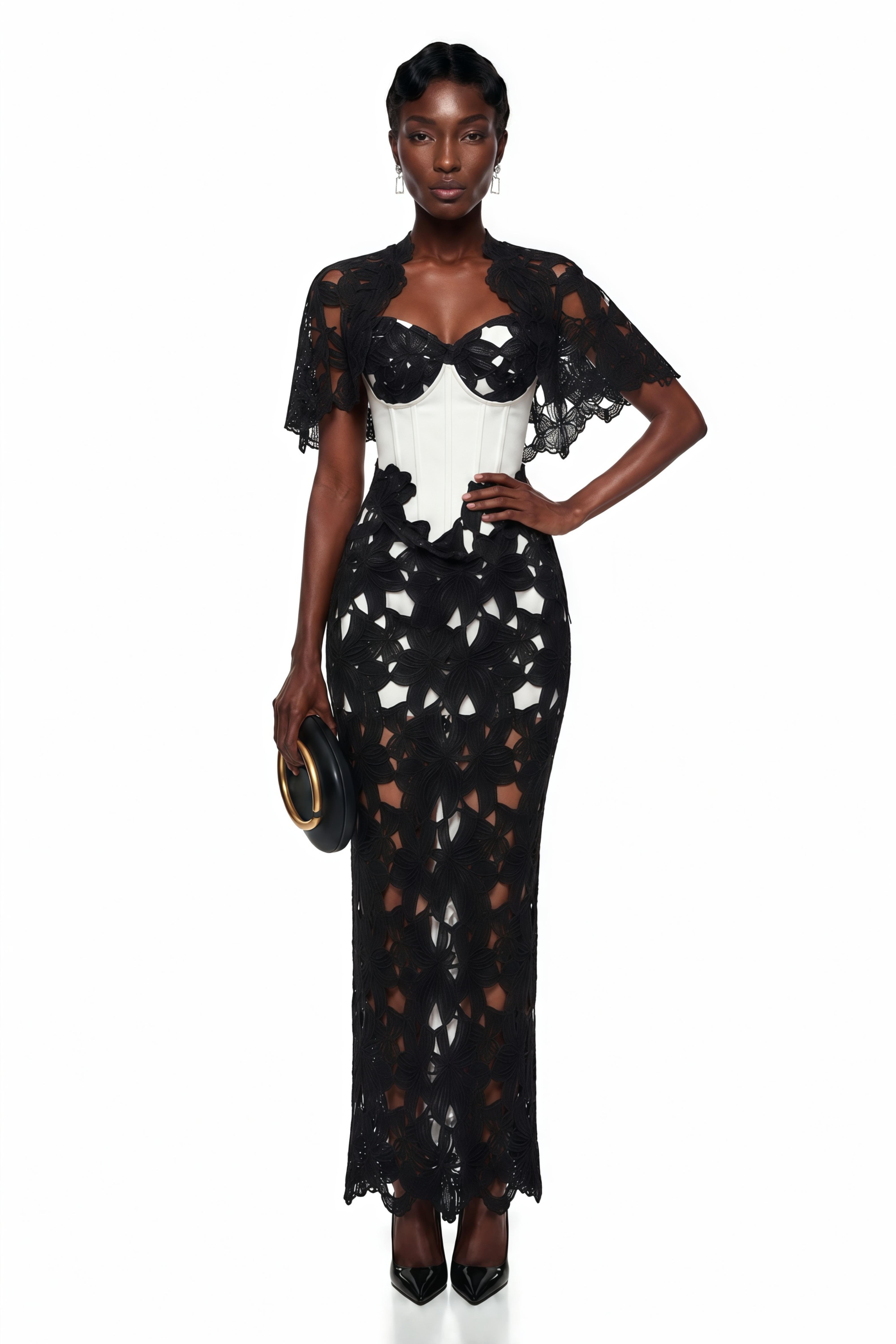 Black and white maxi dress with a cutout lace overlay, white corset bodice, and matching caplet shrug