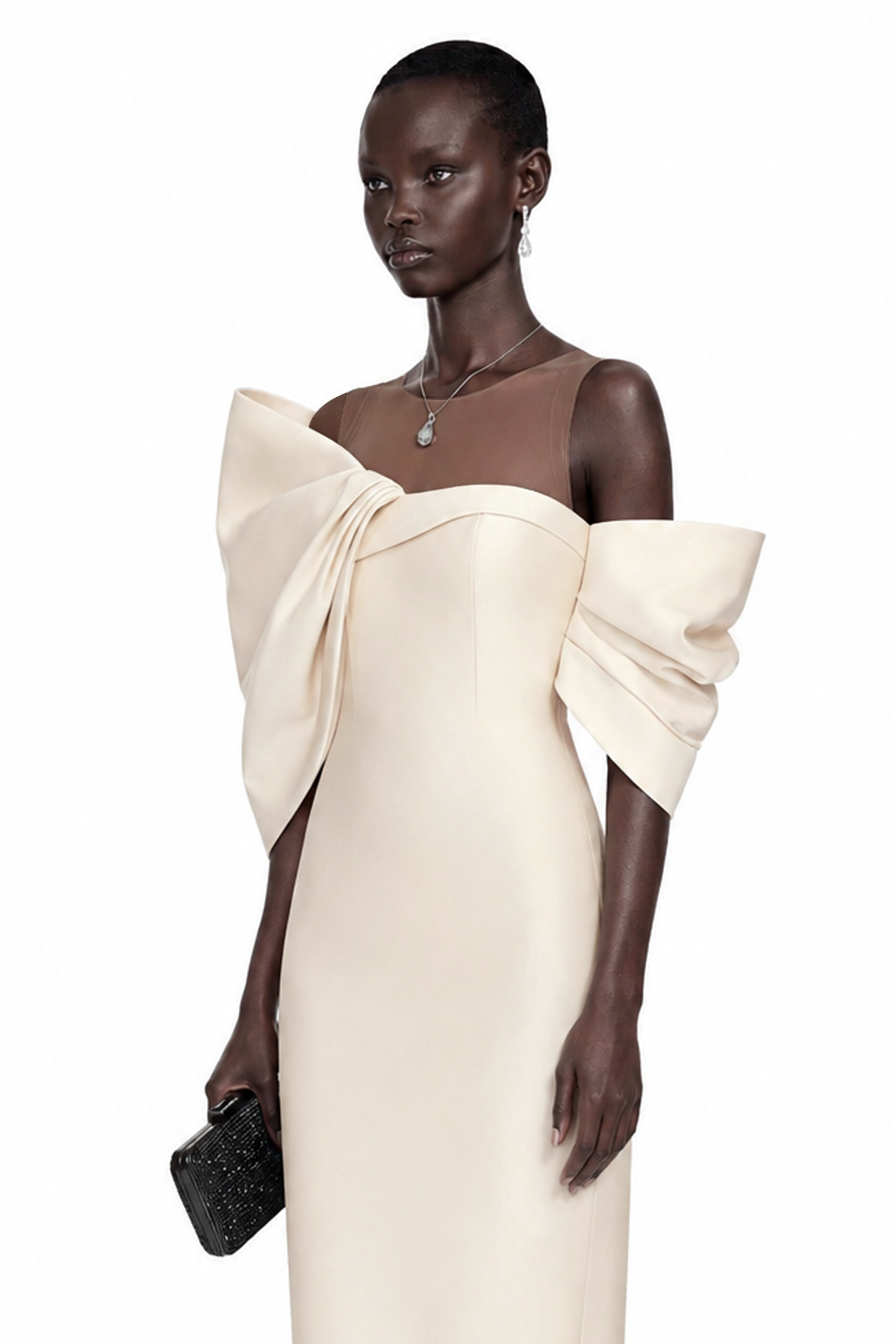 Cream midi dress with an asymmetric off-the-shoulder bow neckline and sheer illusion panel