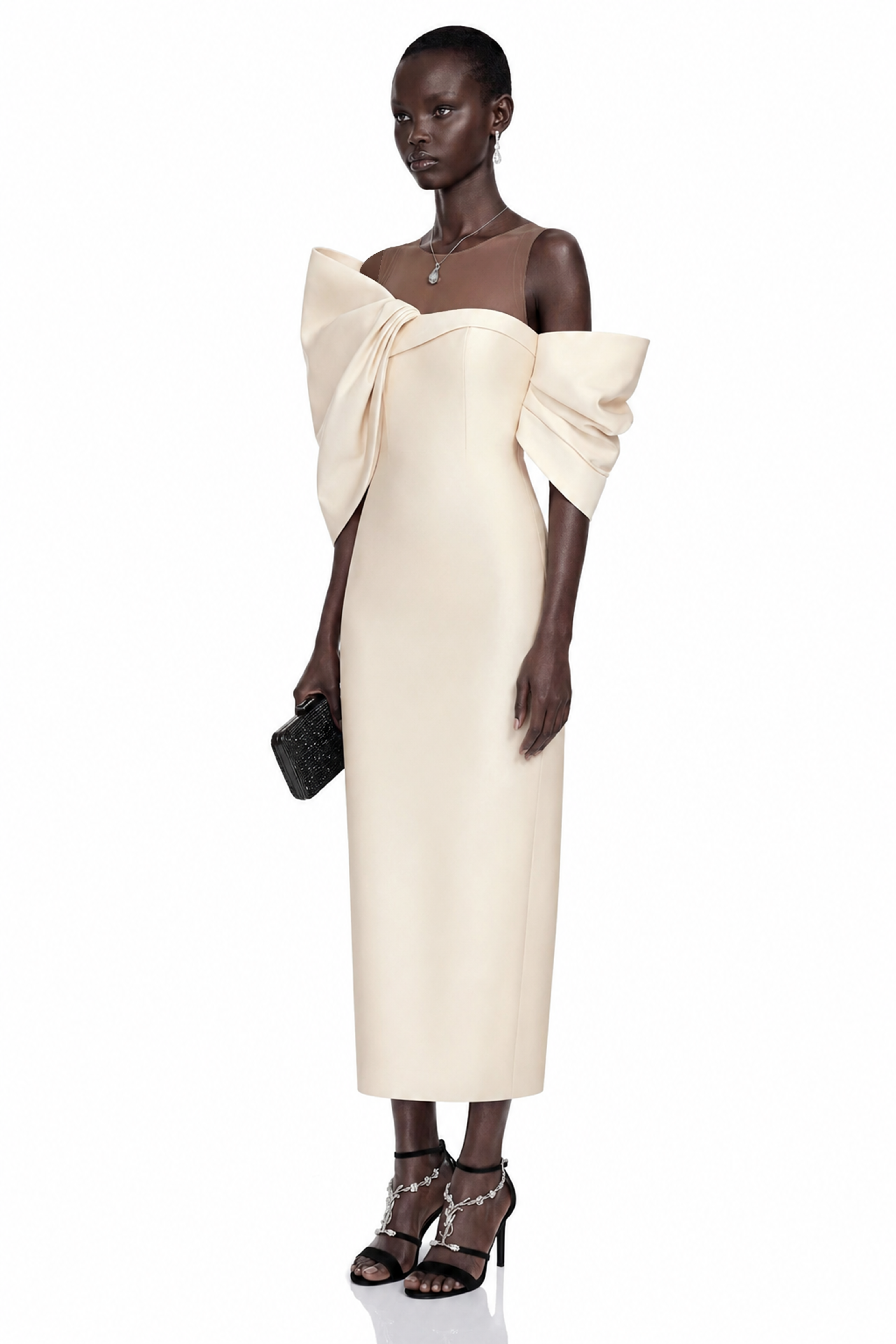 Cream midi dress with an asymmetric off-the-shoulder bow neckline and sheer illusion panel