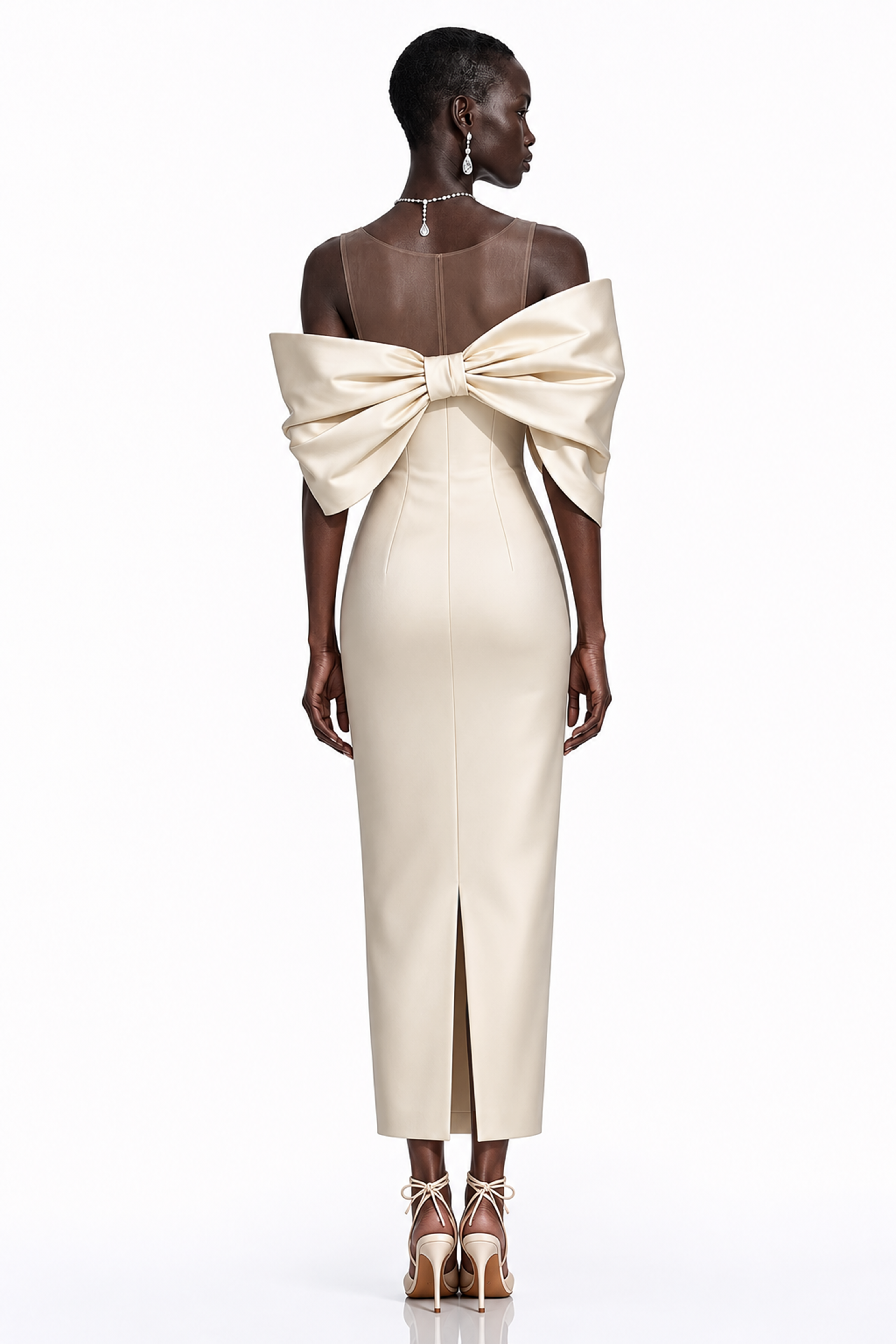 Cream midi dress with an asymmetric off-the-shoulder bow neckline and sheer illusion panel