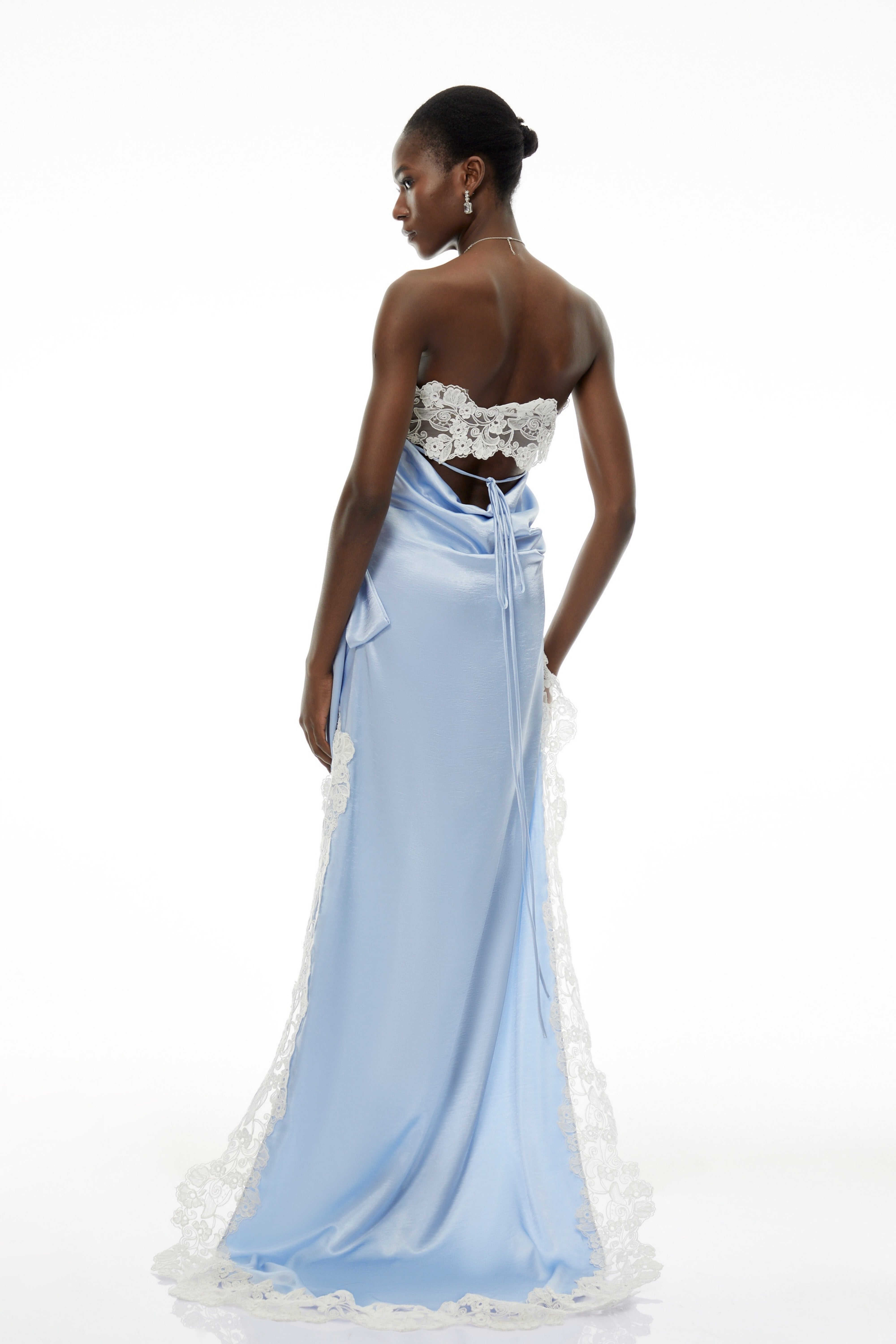 Light blue satin strapless mini dress with white lace trim, side bow detail, and a long asymmetrical train