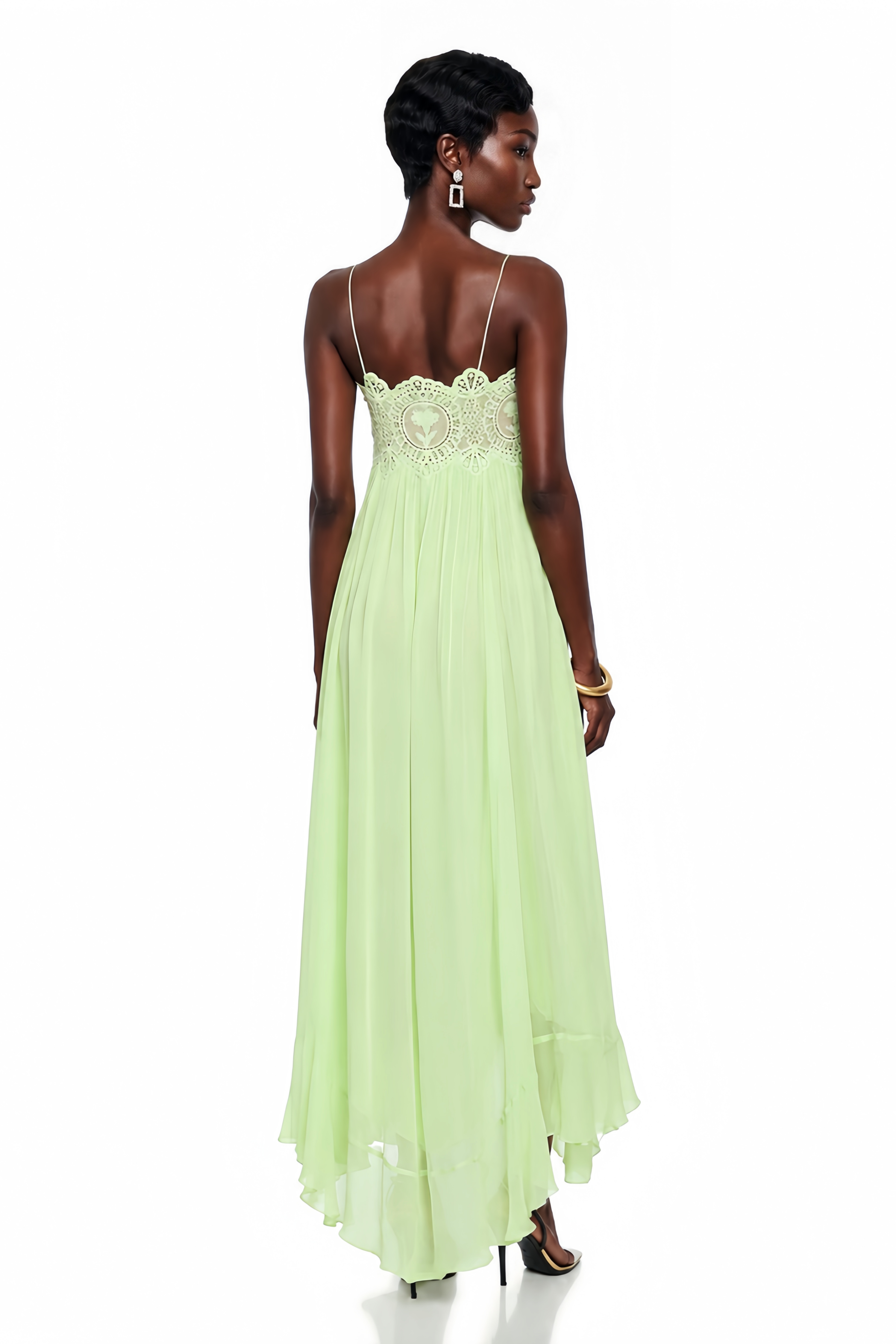 Mint green maxi dress with spaghetti straps, a scalloped lace bodice, and a flowing pleated skirt