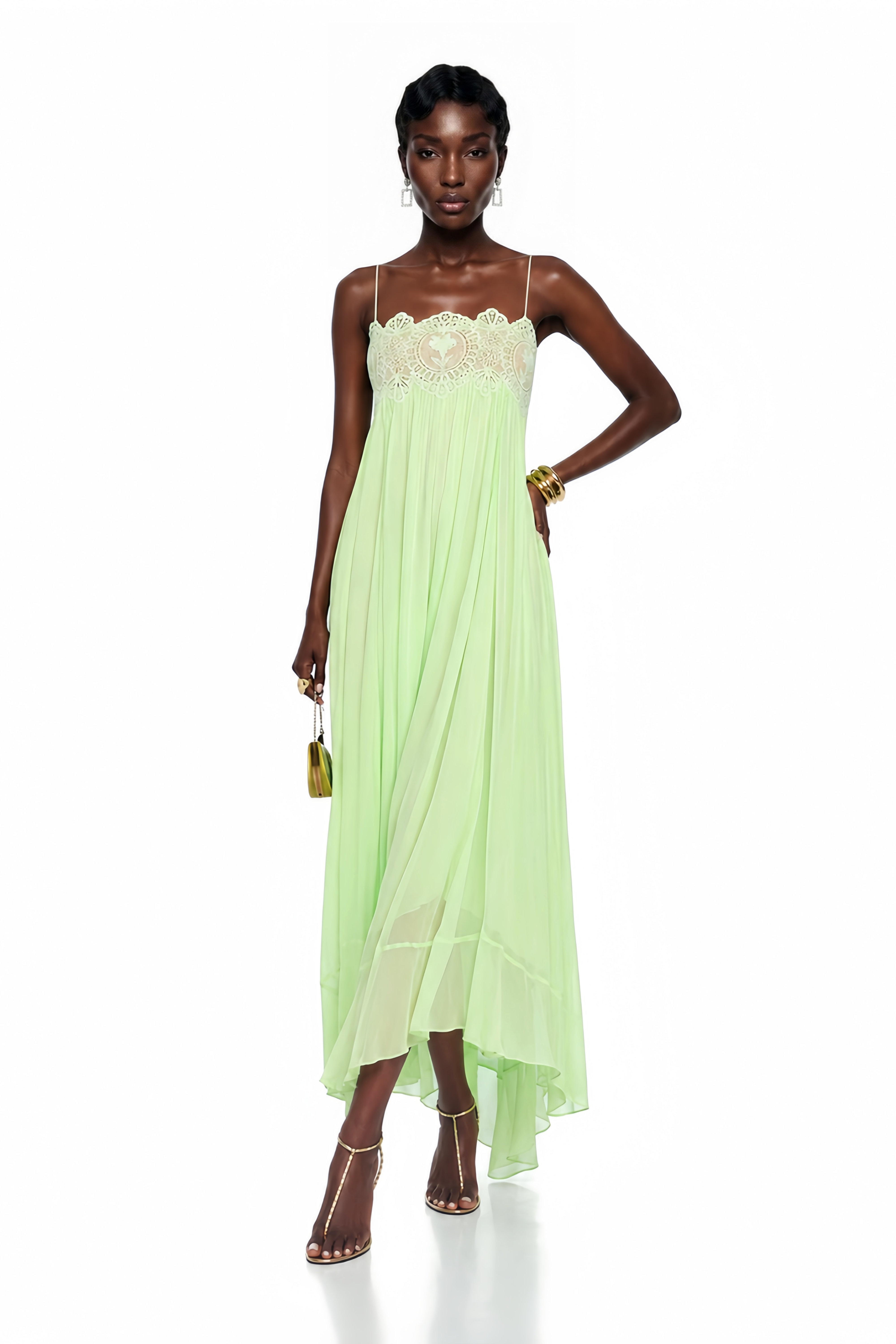 Mint green maxi dress with spaghetti straps, a scalloped lace bodice, and a flowing pleated skirt