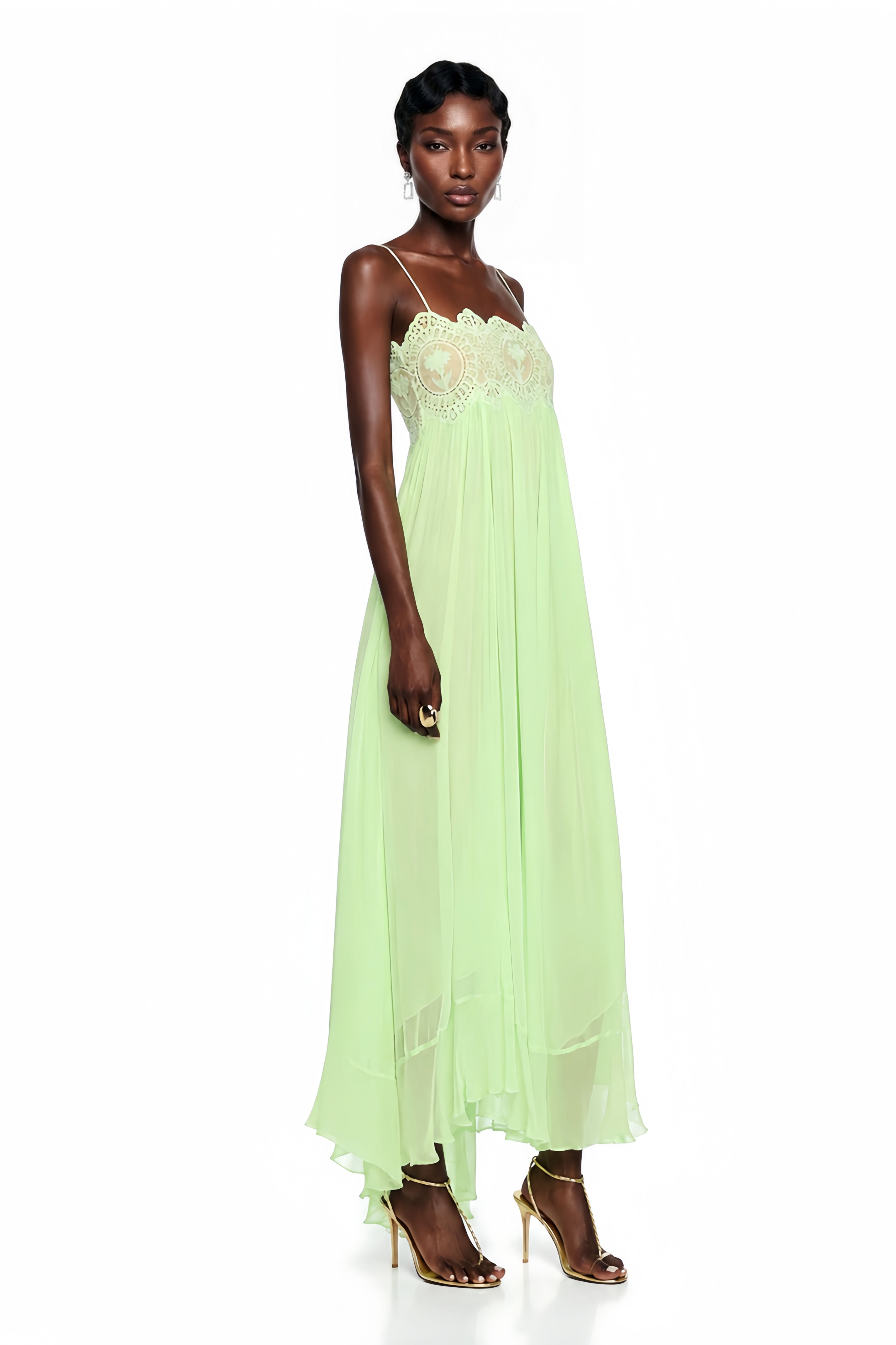 Mint green maxi dress with spaghetti straps, a scalloped lace bodice, and a flowing pleated skirt