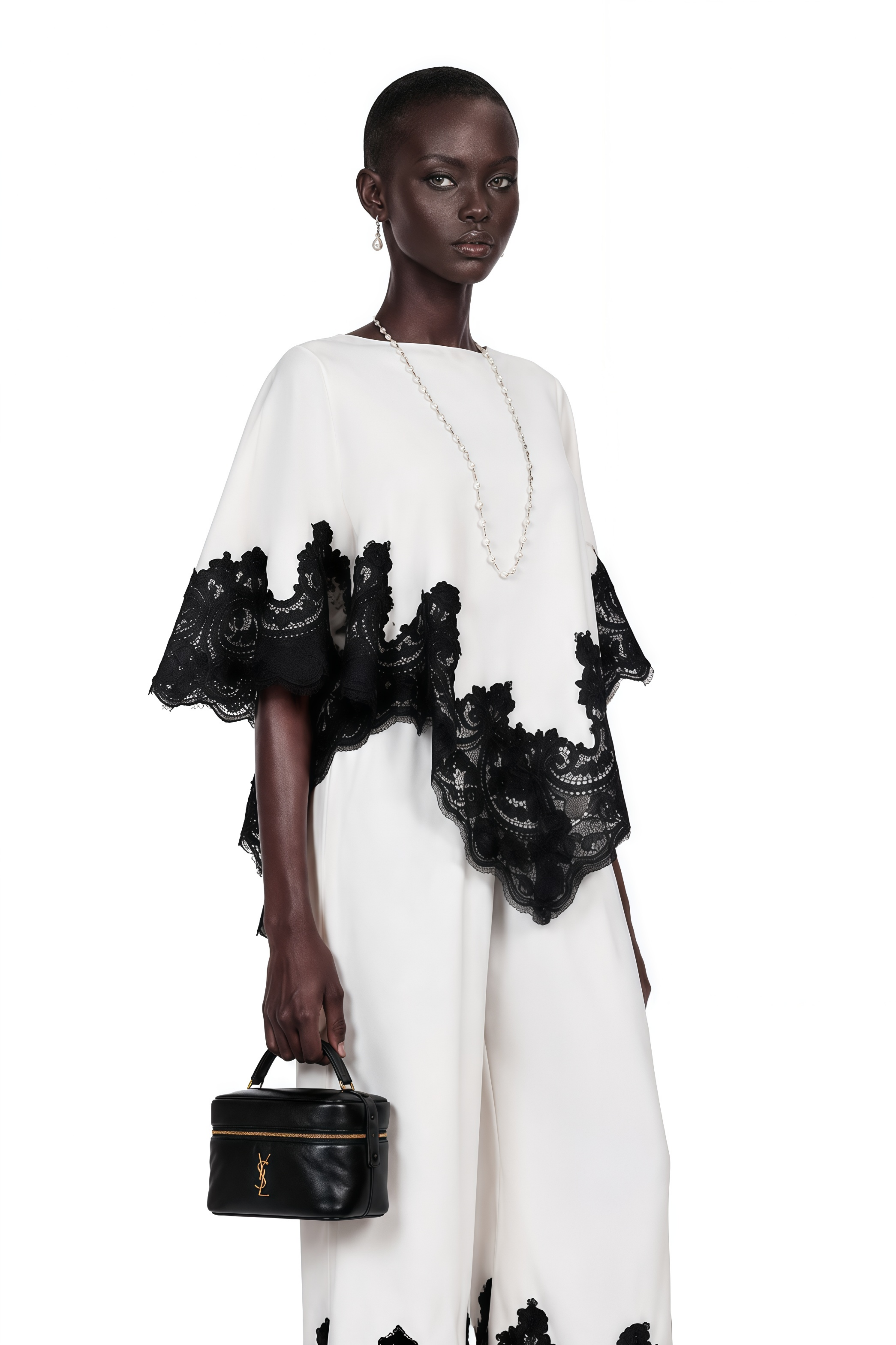 White high-neck cape top and wide-leg trousers set with black lace trim