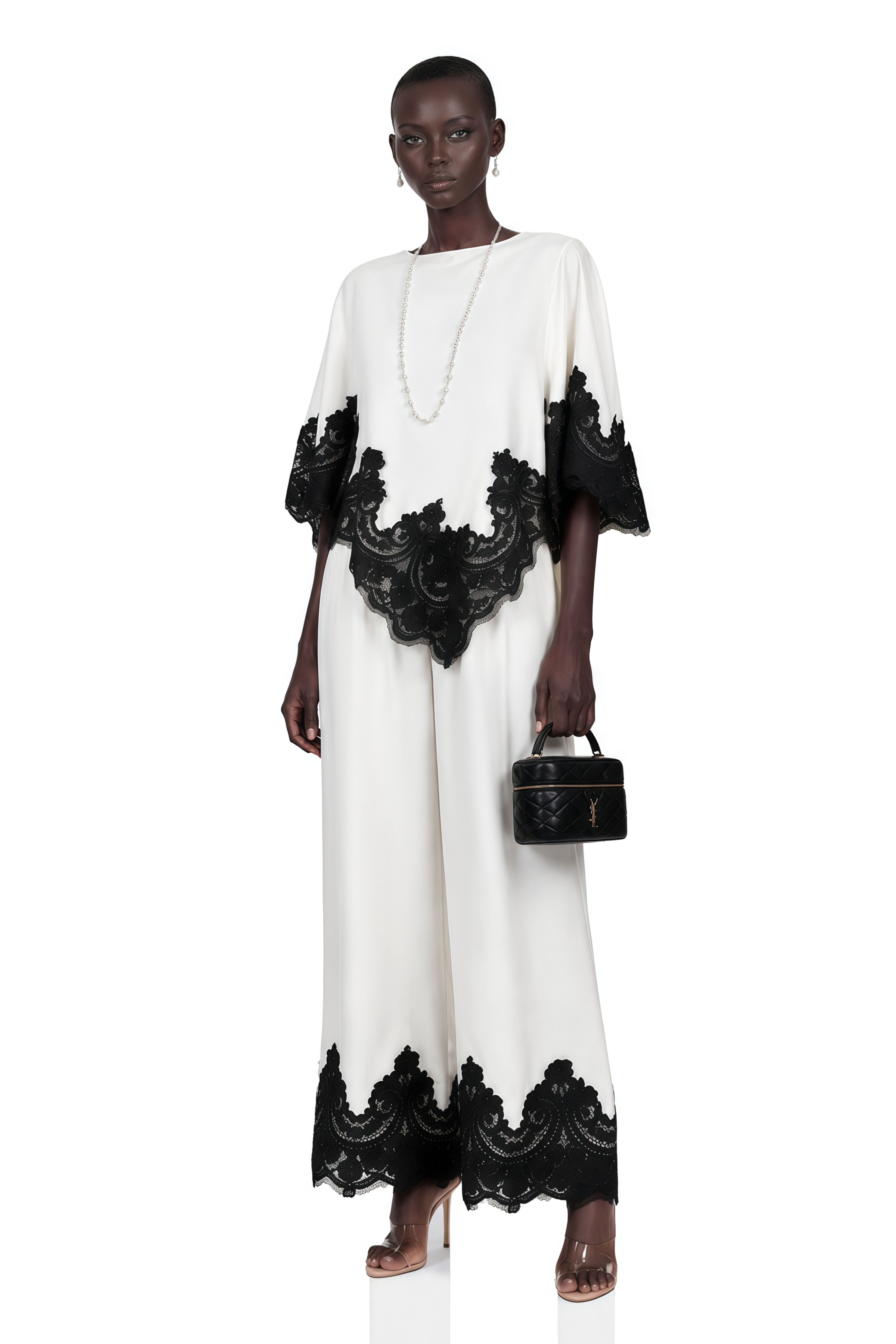 White high-neck cape top and wide-leg trousers set with black lace trim