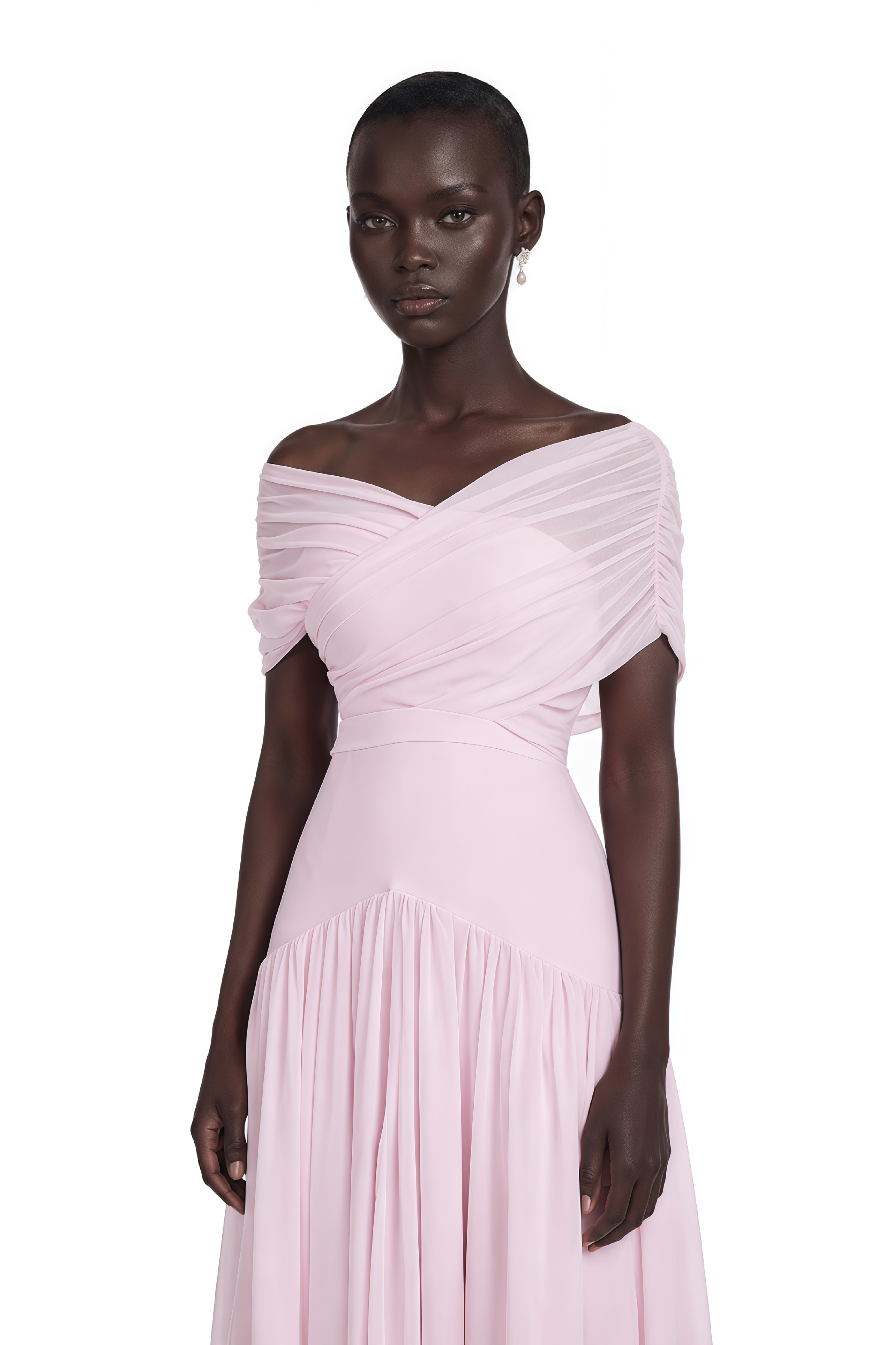 Light pink off-the-shoulder maxi dress with a criss-cross bodice and flowing skirt