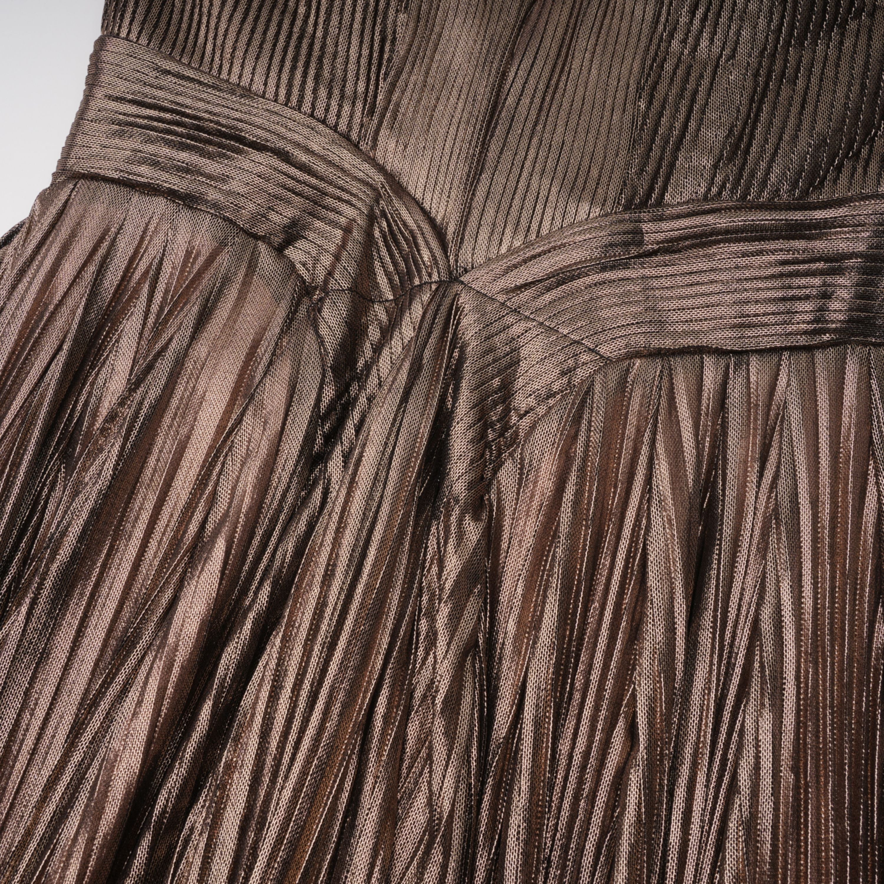 Bronze metallic plissé maxi dress with a plunging V-neckline and off-the-shoulder straps