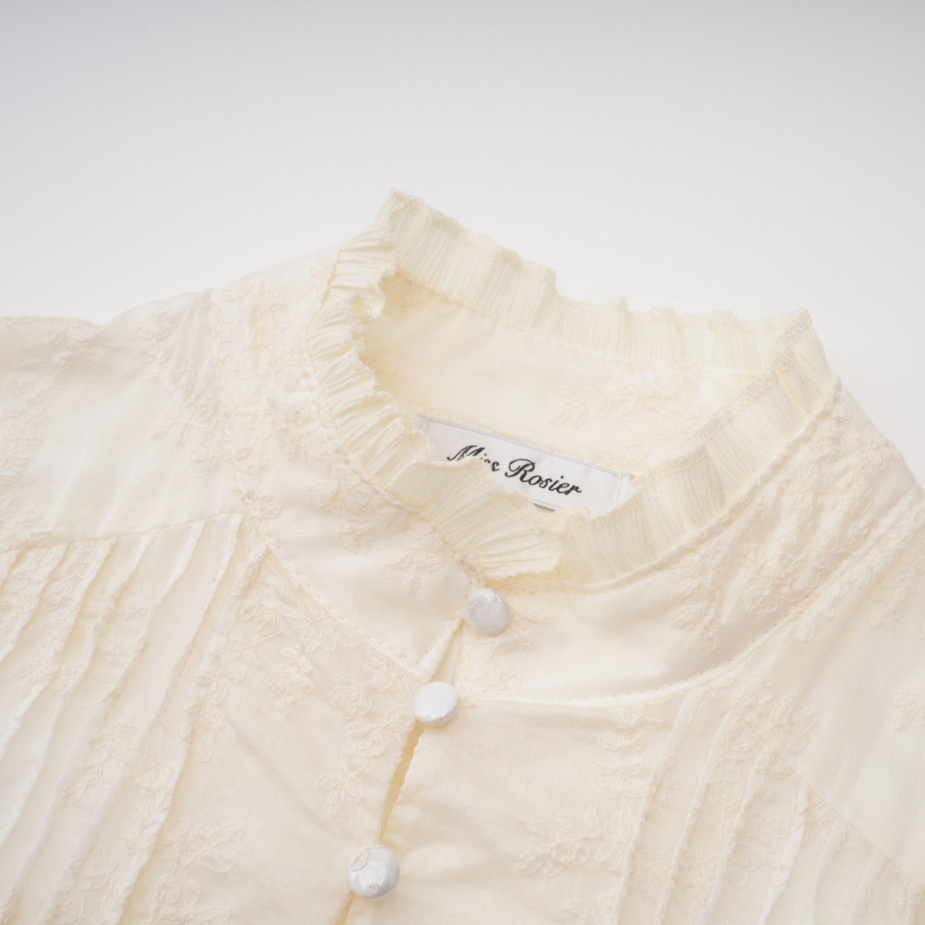 Off-white corset top and ruffled mini skirt set with sheer lace long sleeves