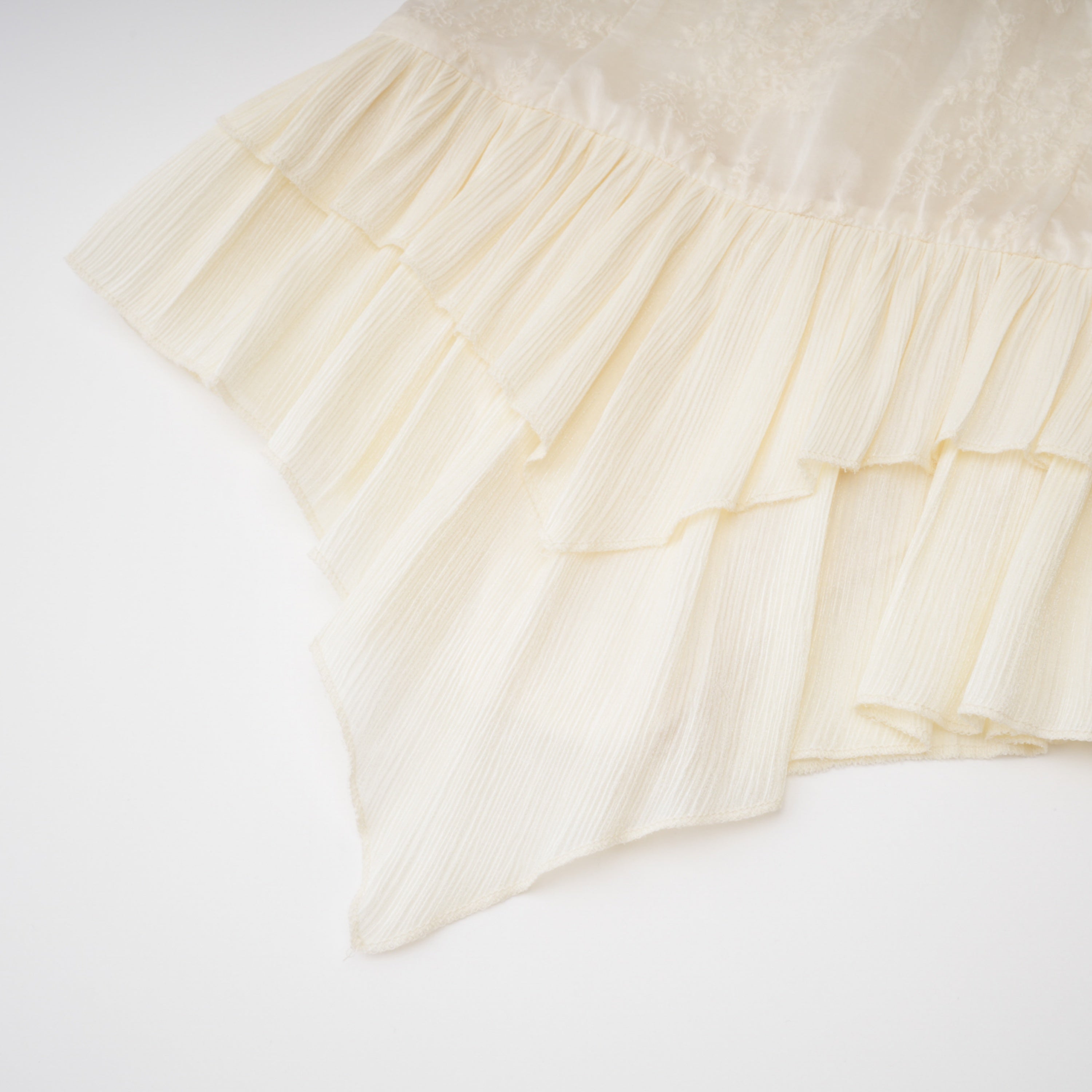 Off-white corset top and ruffled mini skirt set with sheer lace long sleeves