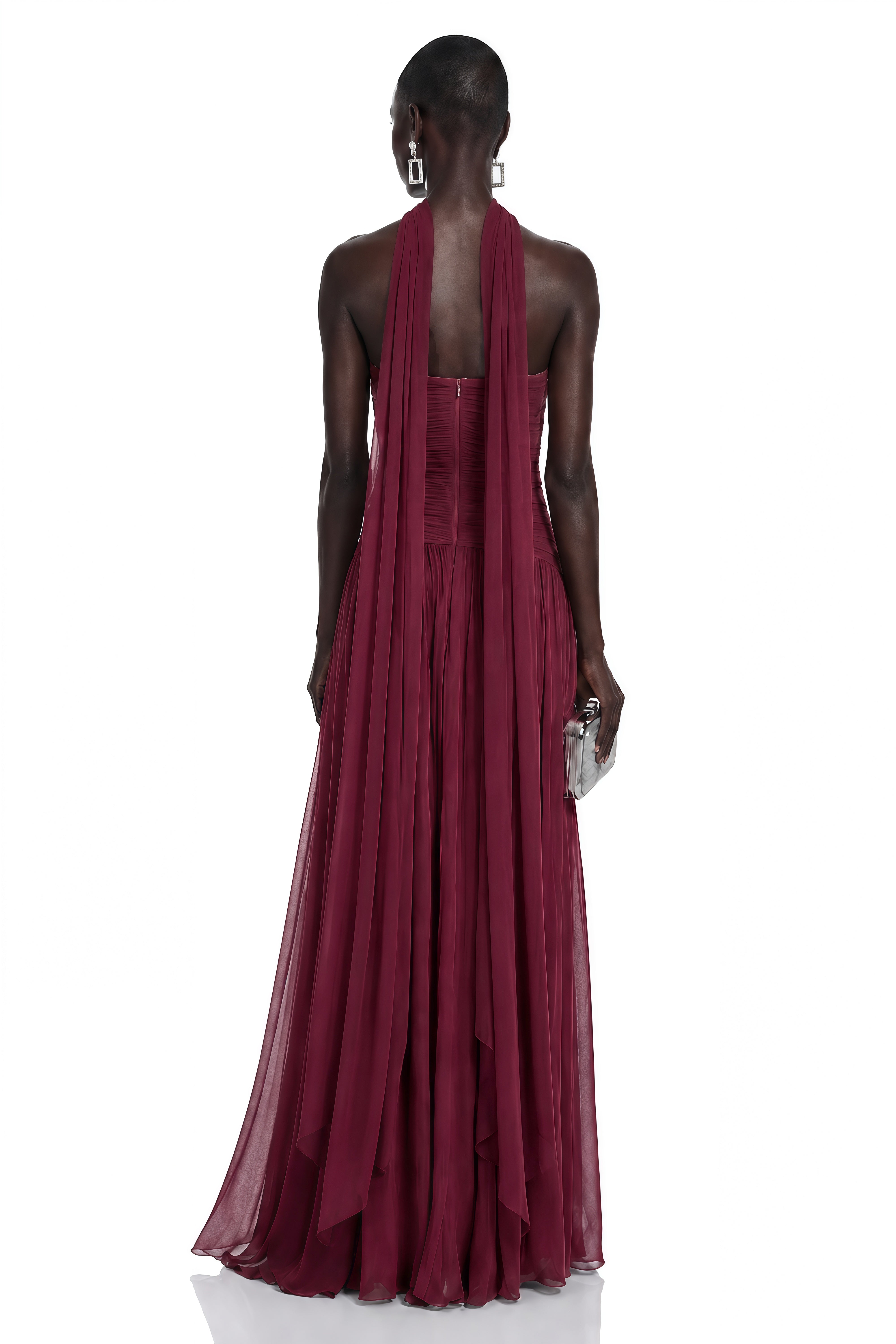 Burgundy strapless pleated maxi dress with a matching cape overlay