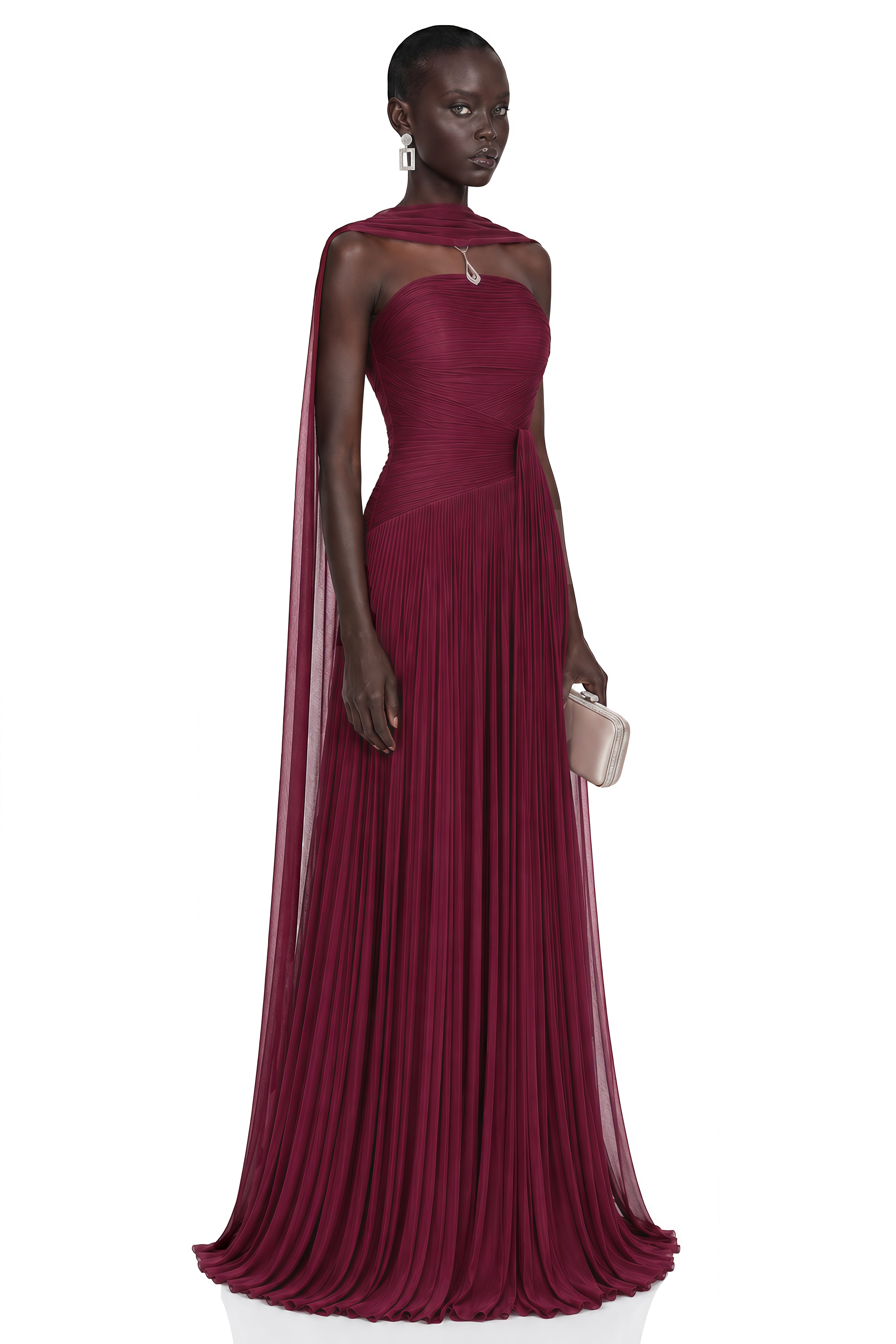 Burgundy strapless pleated maxi dress with a matching cape overlay