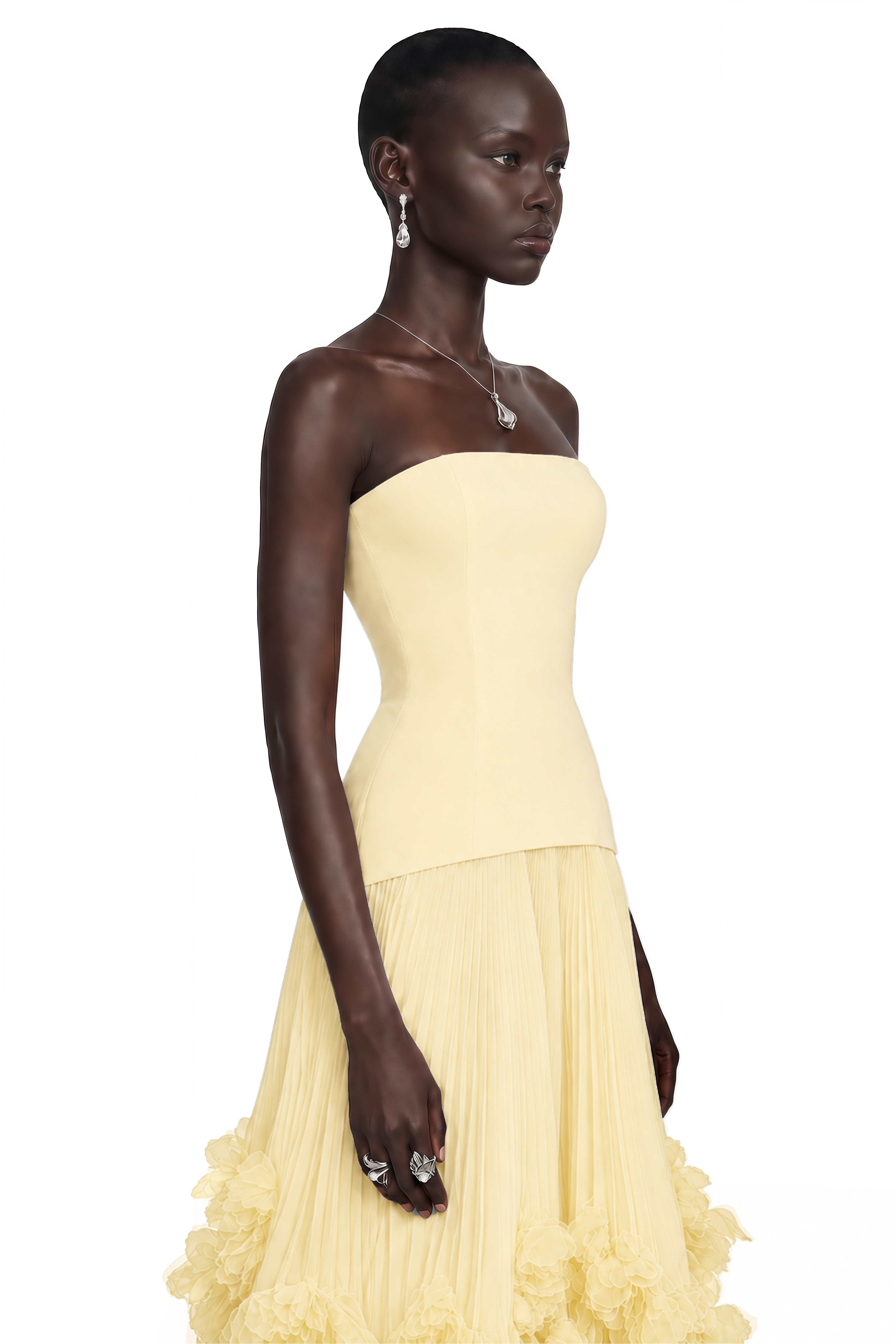 Pale yellow strapless gown with fitted bodice and ruffled tulle skirt