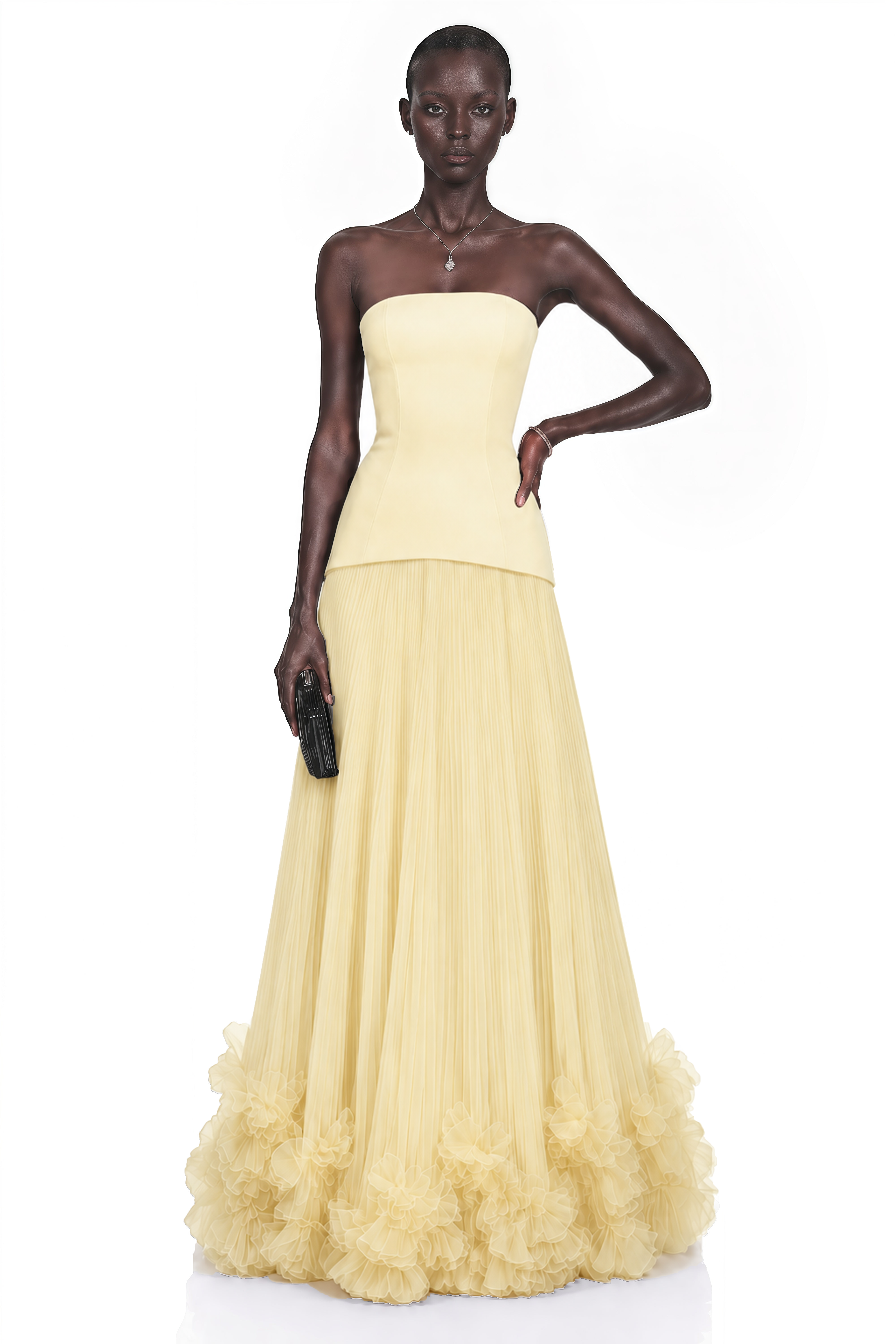Pale yellow strapless gown with fitted bodice and ruffled tulle skirt