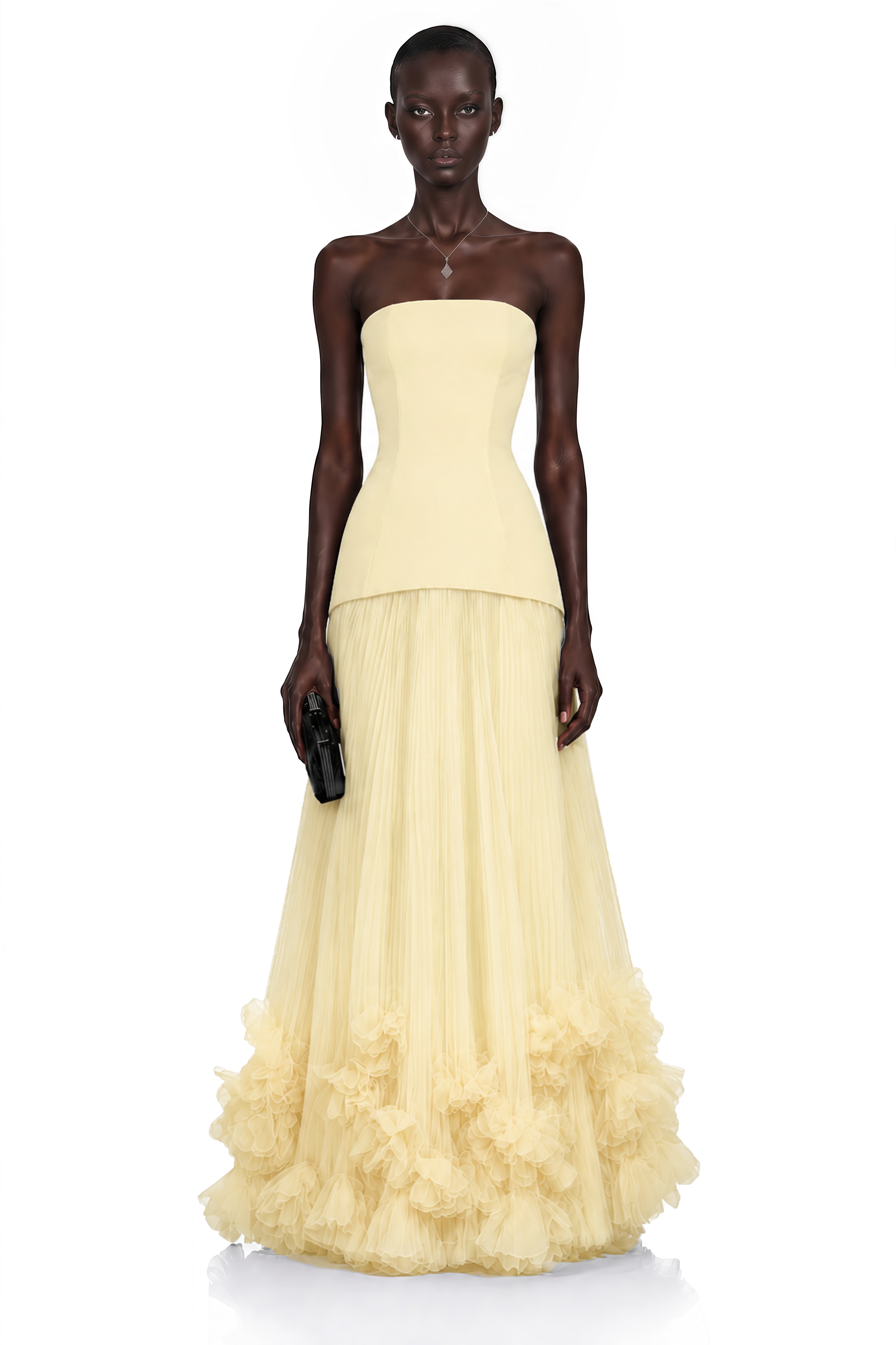Pale yellow strapless gown with fitted bodice and ruffled tulle skirt