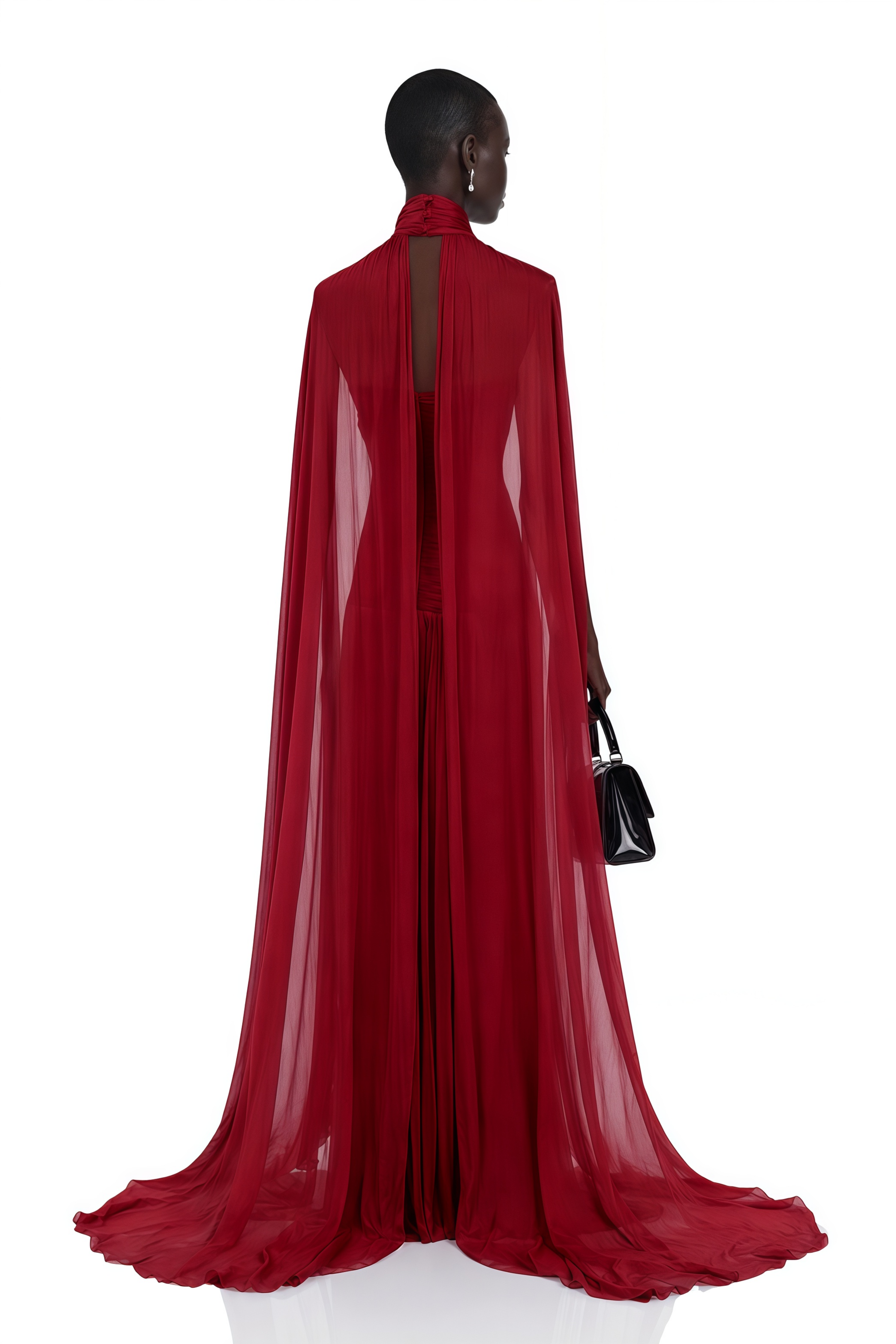 Deep red high-neck halter gown with floor-length cape sleeves