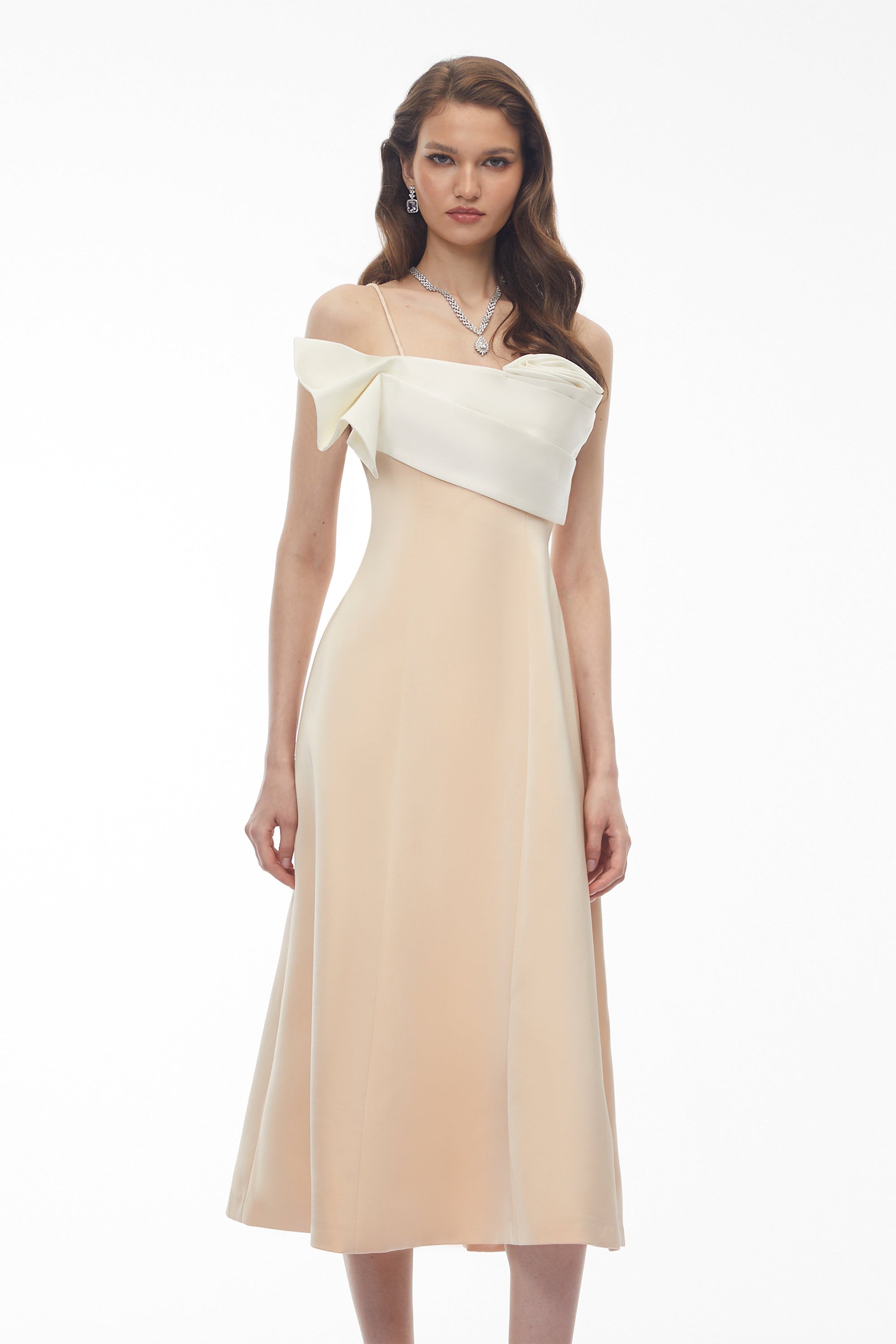 Cream midi dress featuring a white satin sculptural bodice and a slim shoulder strap