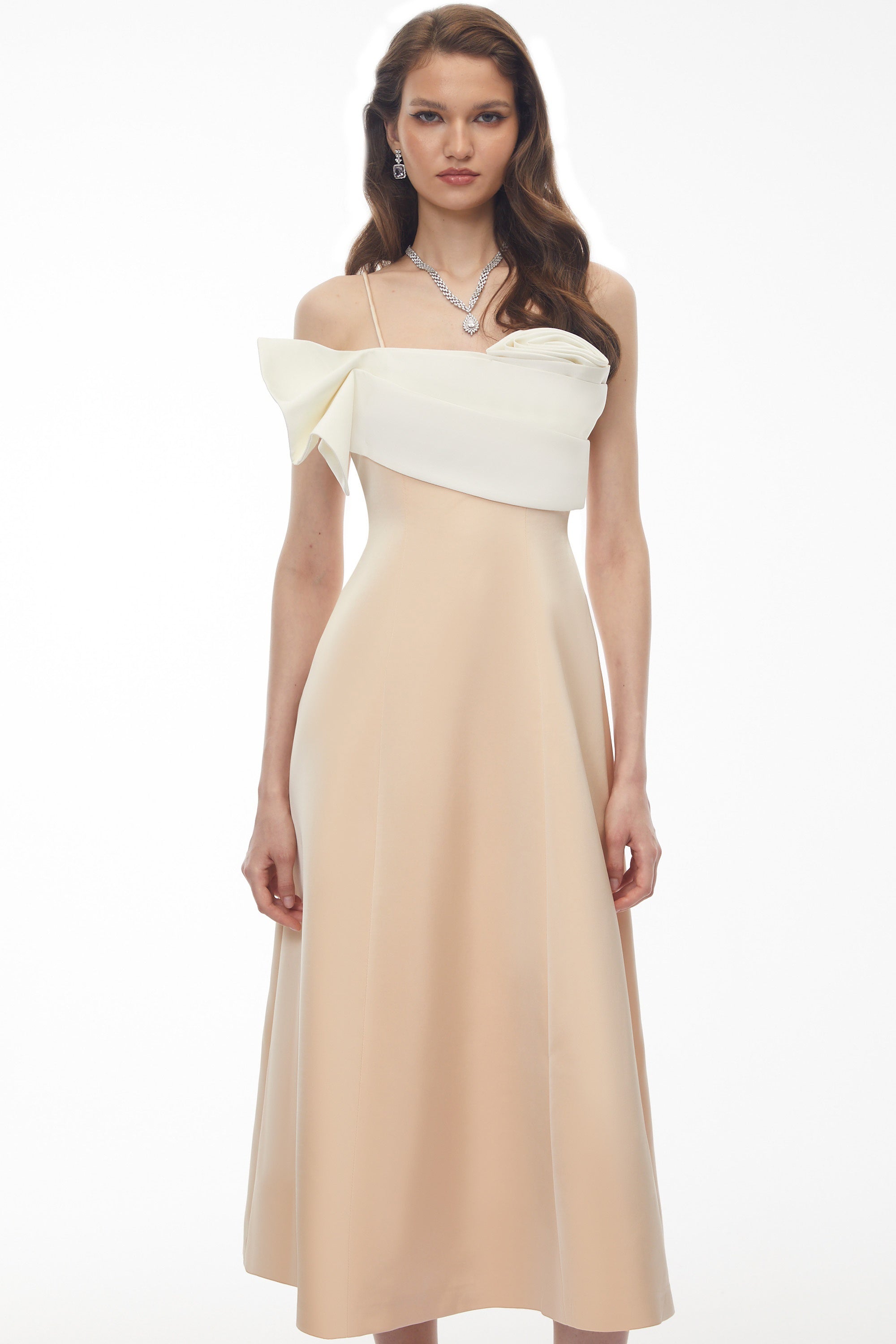 Cream midi dress featuring a white satin sculptural bodice and a slim shoulder strap