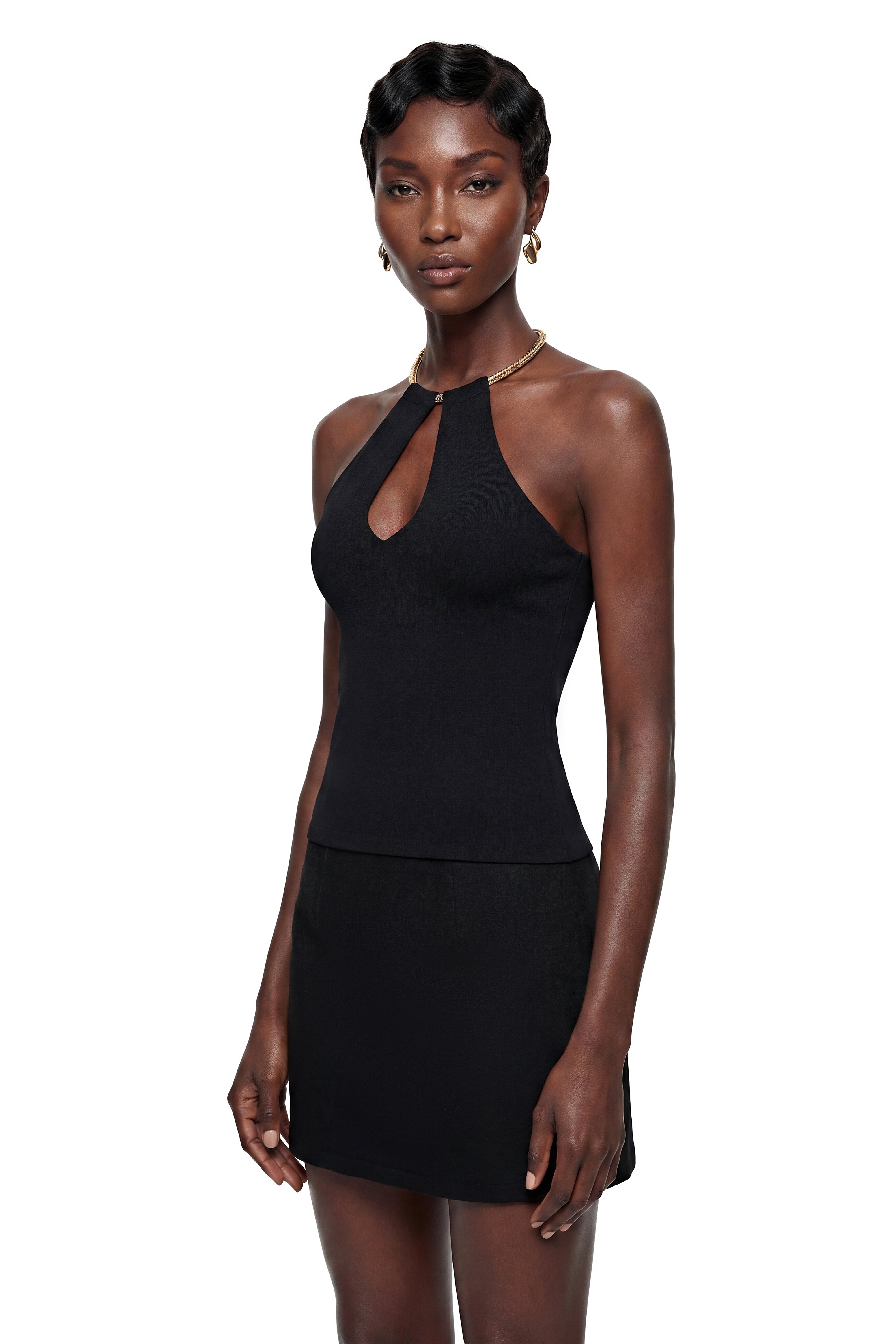 Black halter top and mini skirt set with gold collar detail
