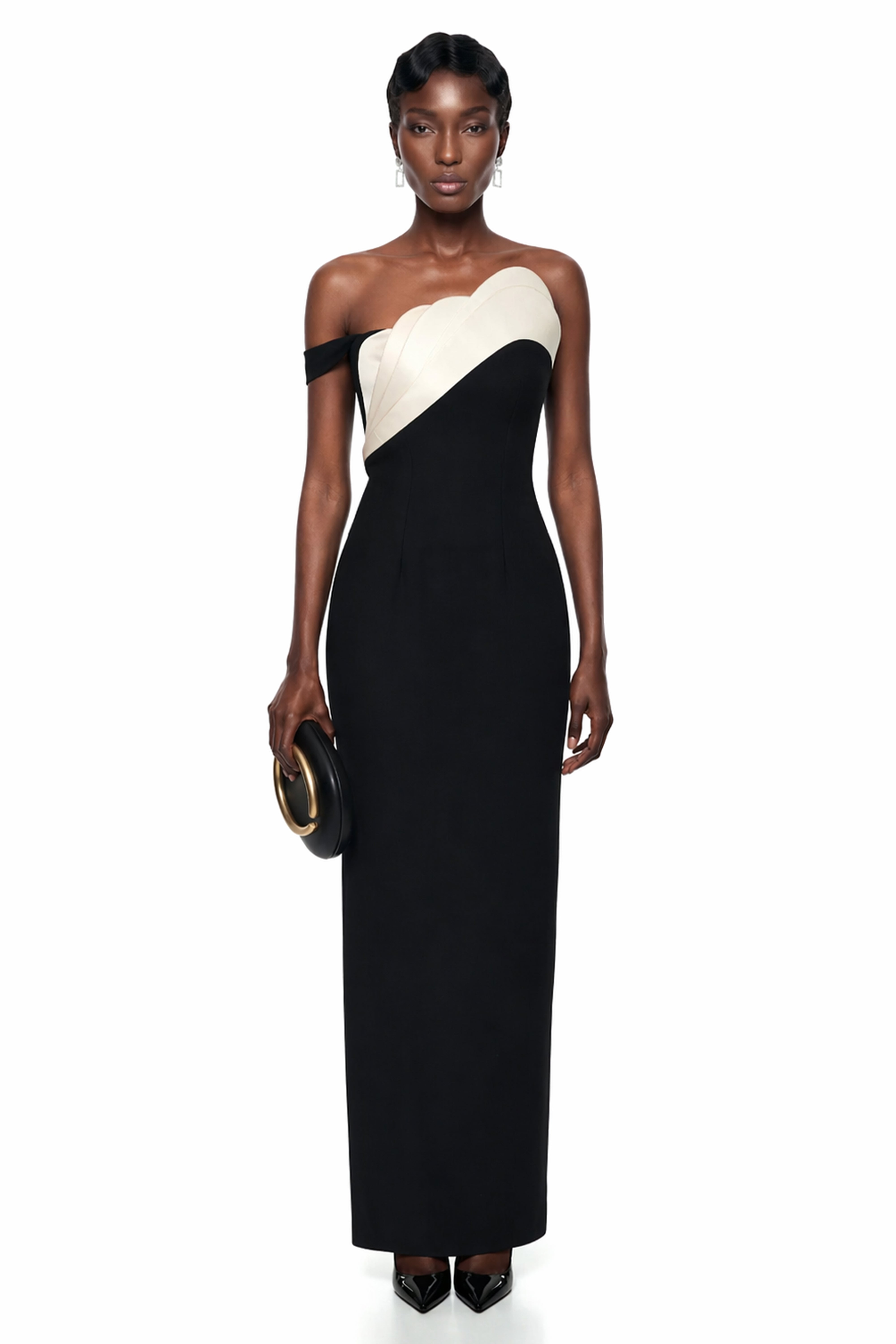 Black column maxi dress featuring a cream scalloped asymmetrical bodice and a single off-the-shoulder strap