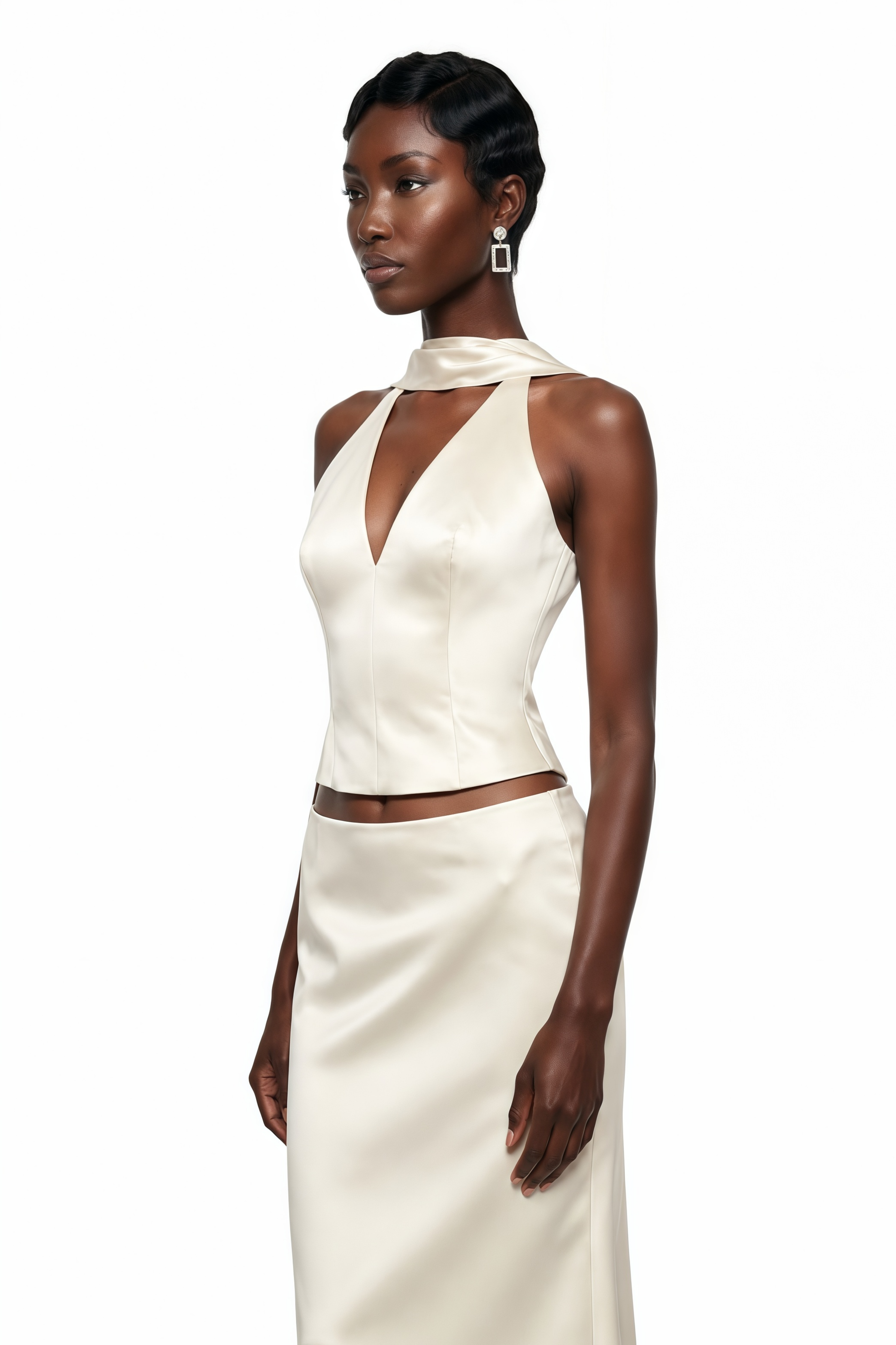 Off-white satin two-piece maxi set featuring a halter V-neck top with a high collar band and a matching bias-cut skirt