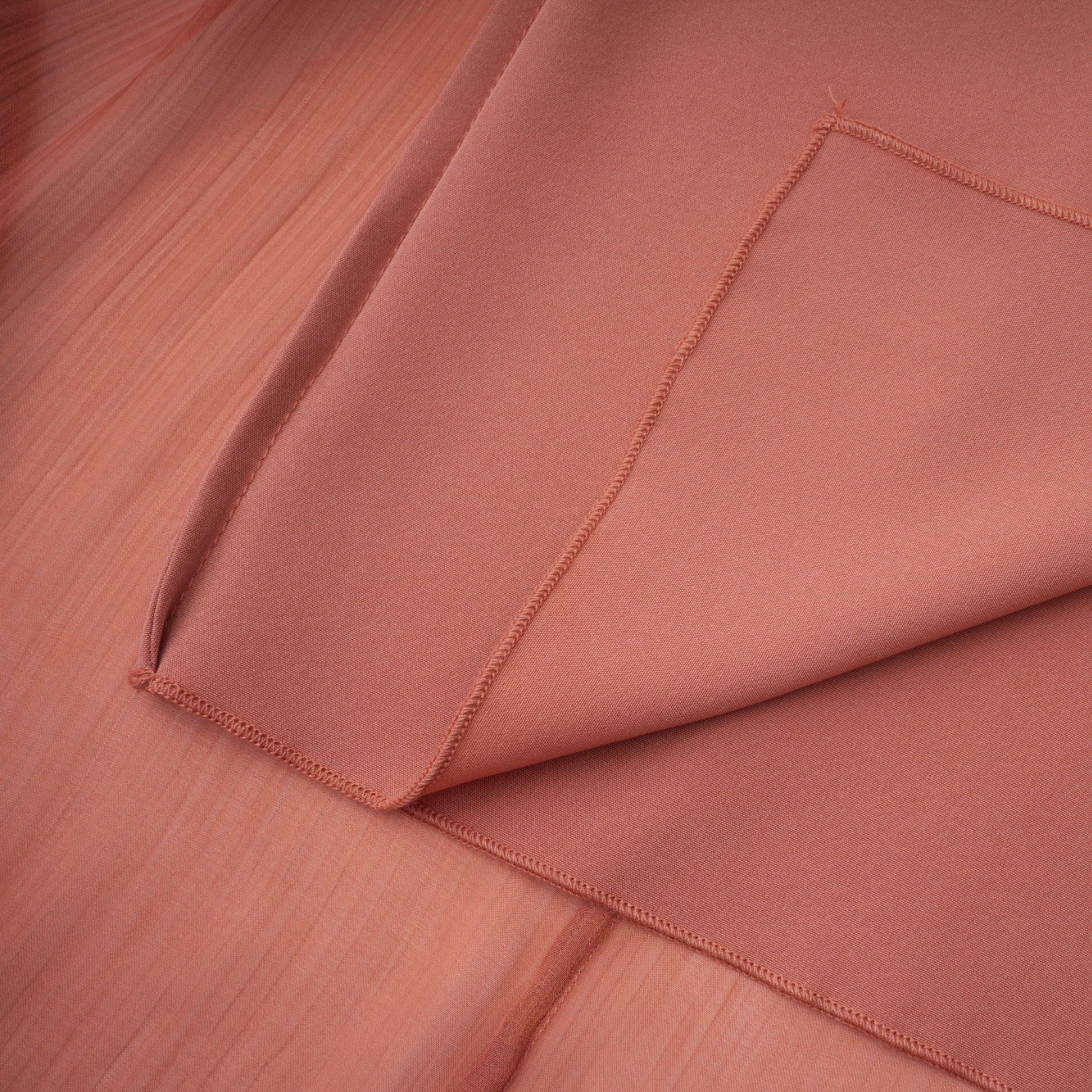 Dusty rose strapless gown with draped skirt and high slit