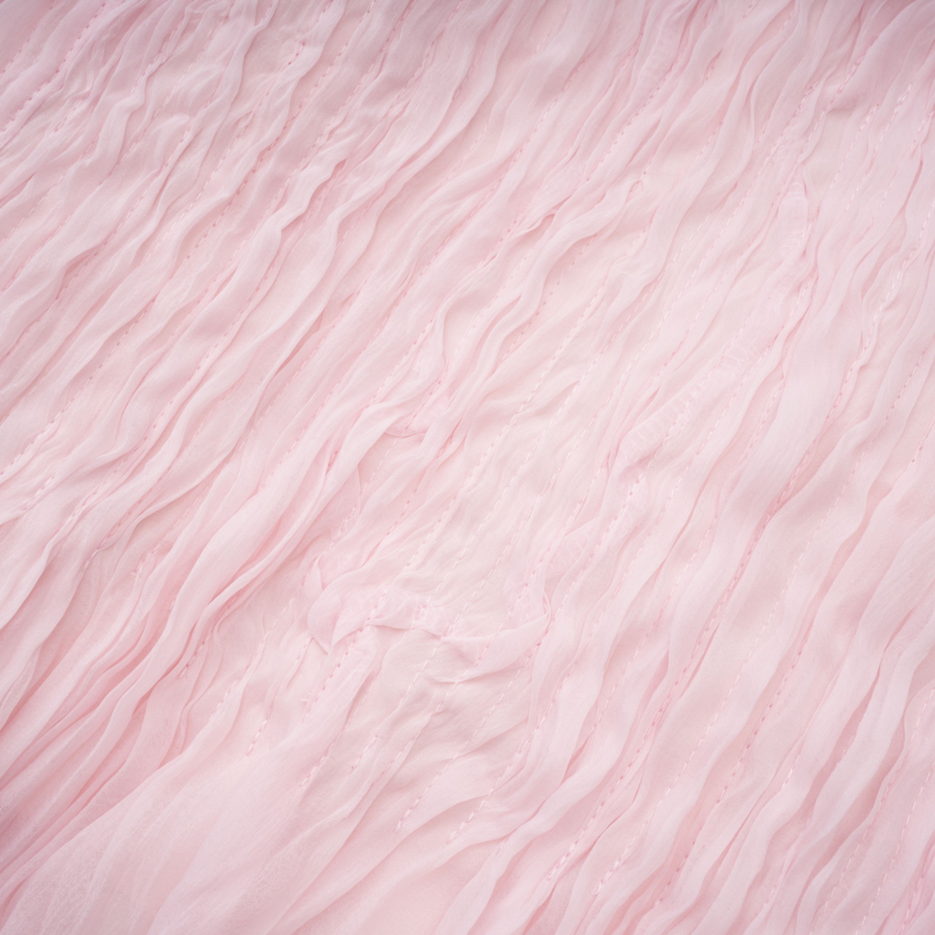 Light pink strapless ruched mini dress featuring a layered ruffle hemline