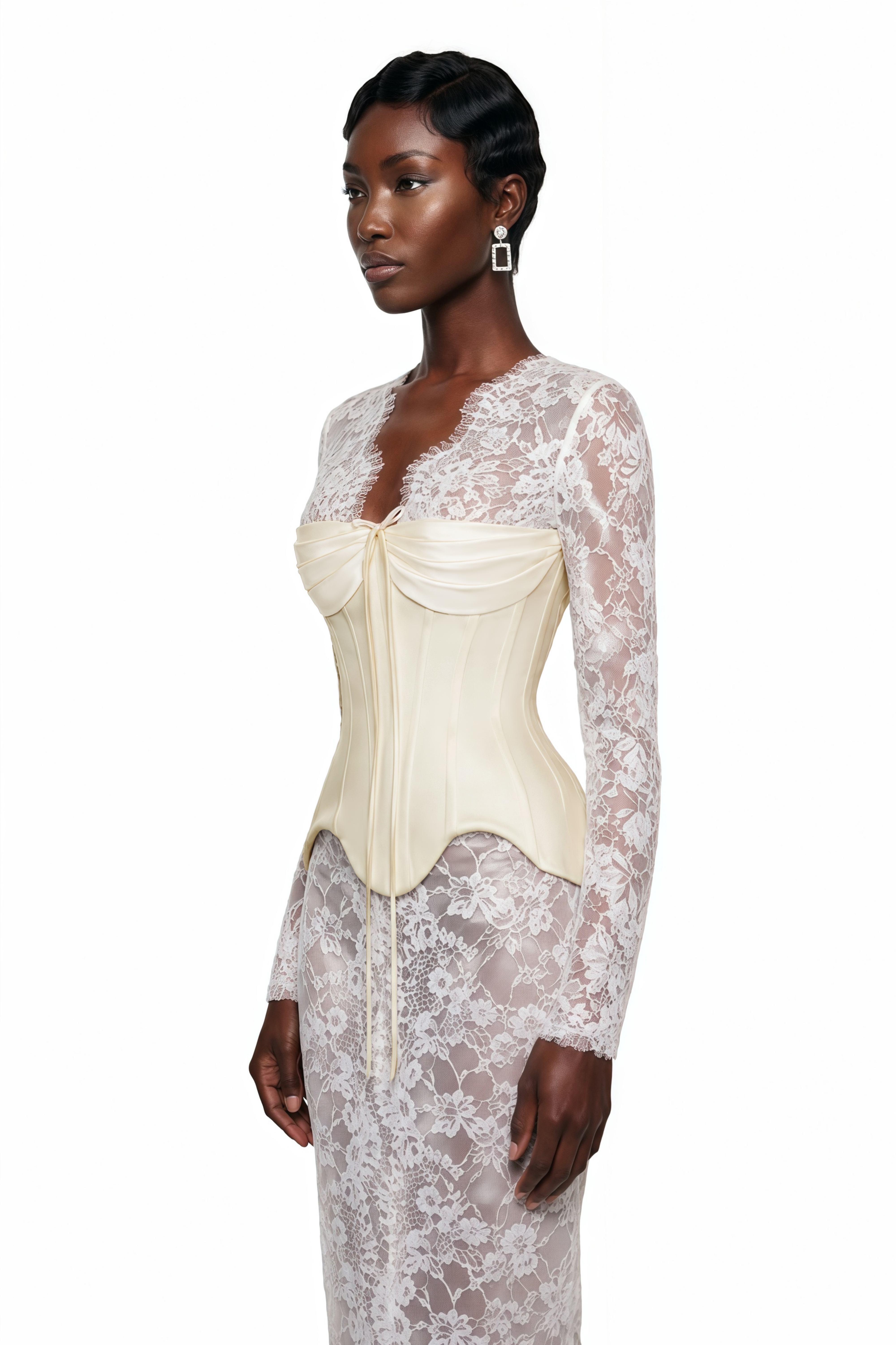 Off-white corset gown over sheer lace long-sleeved dress
