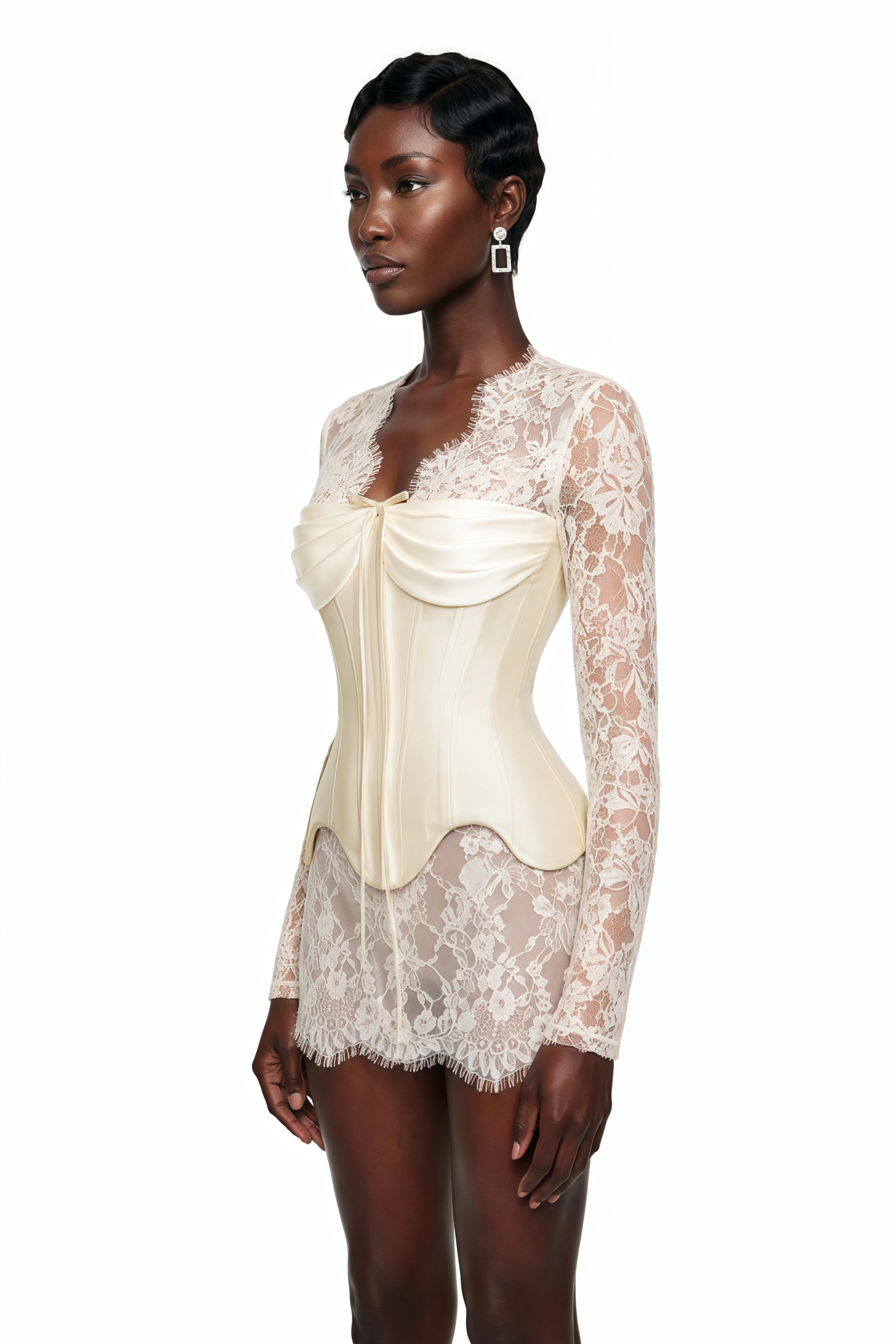 White sheer lace long-sleeve mini dress featuring a structured cream satin corset bodice with a tie detail