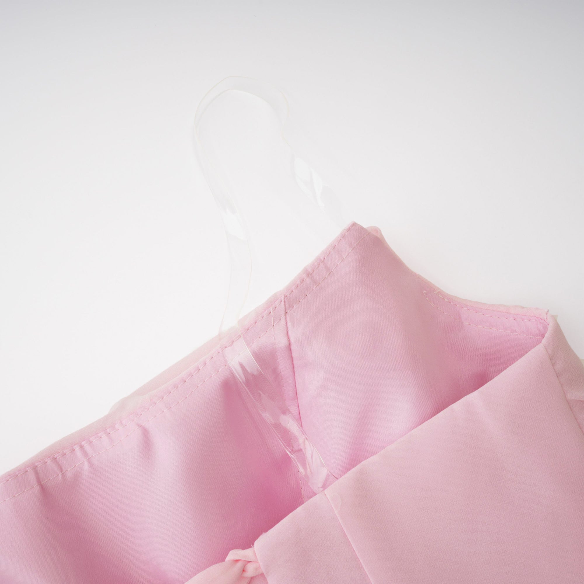 Pink strapless maxi dress with a draped cowl neckline and a matching long neck scarf