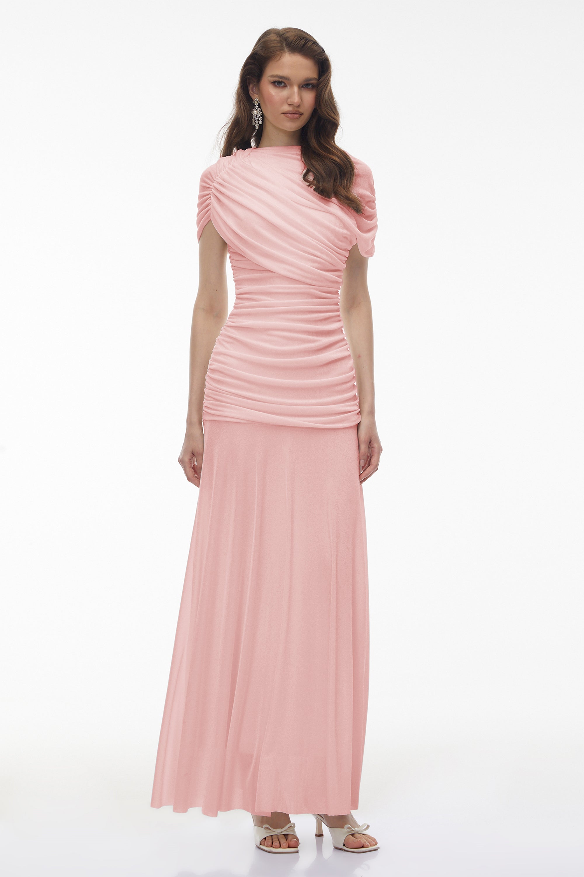 Light pink maxi dress with an asymmetric draped cowl neckline, a ruched bodice, and a flowing skirt