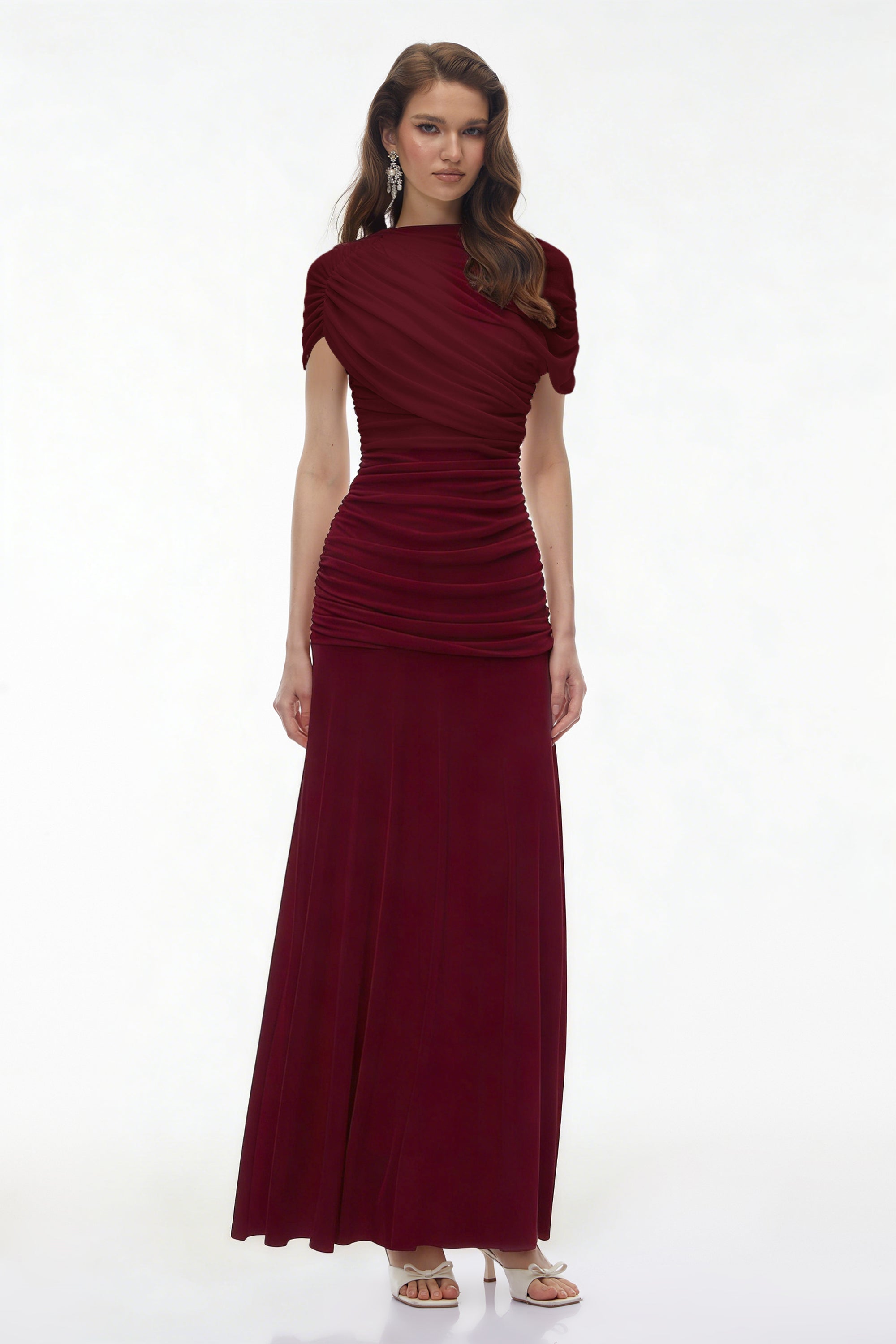 Burgundy maxi dress with an asymmetric draped cowl neckline, a ruched bodice, and a flowing skirt
