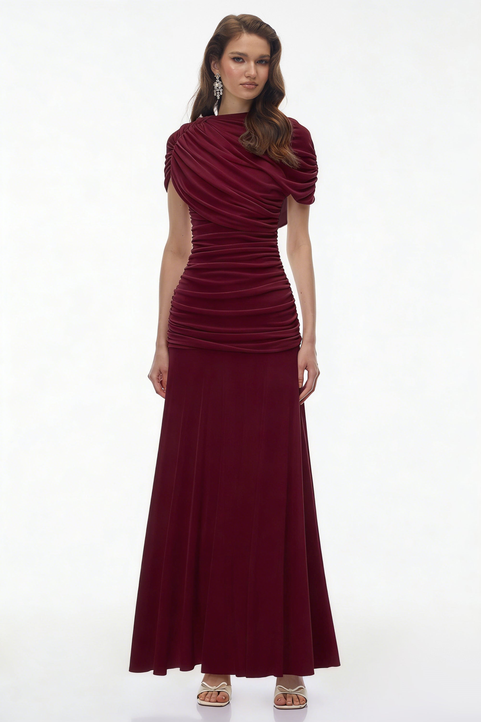 Burgundy maxi dress with an asymmetric draped cowl neckline, a ruched bodice, and a flowing skirt
