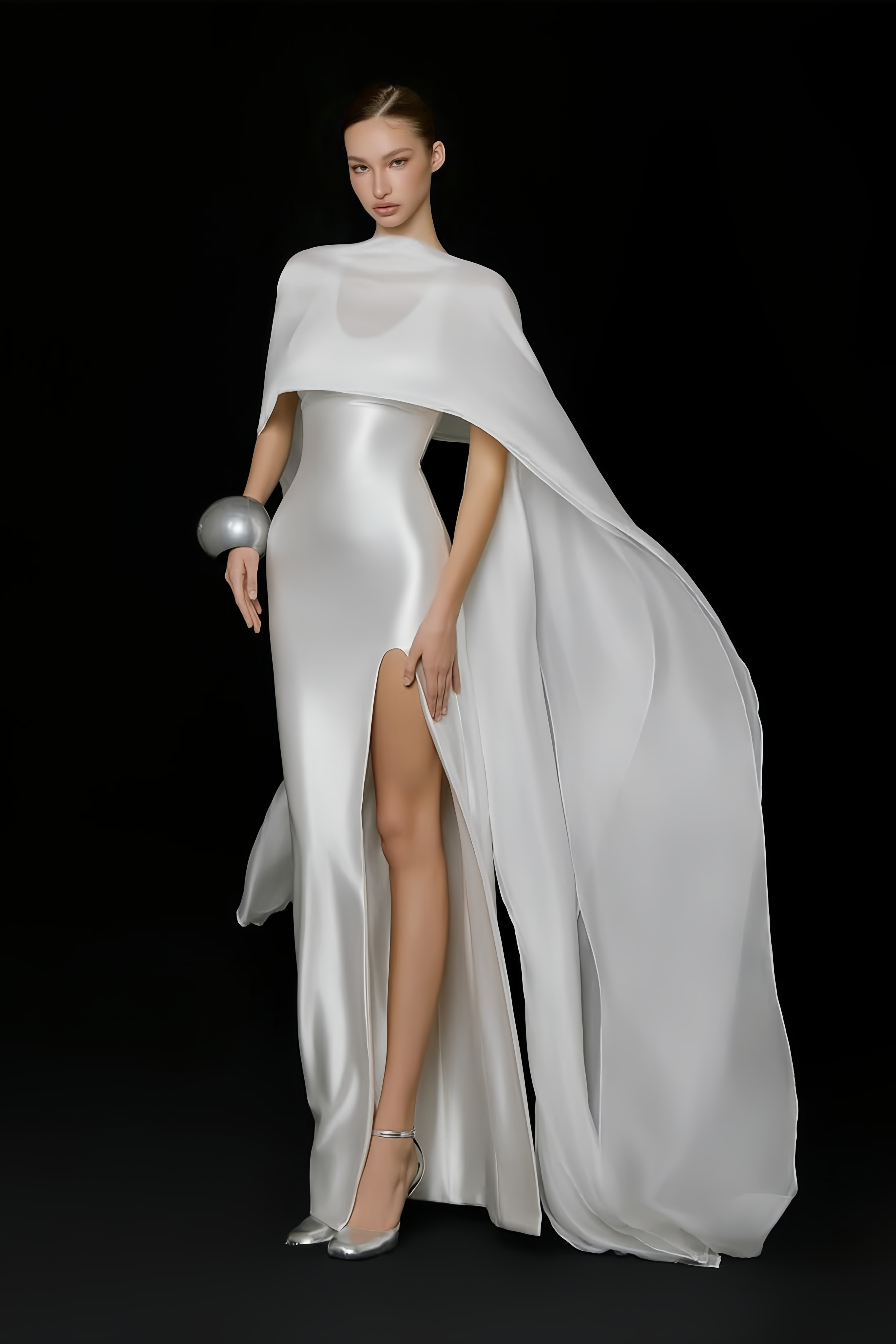 Elegant white satin gown with a matching long cape and a high leg slit