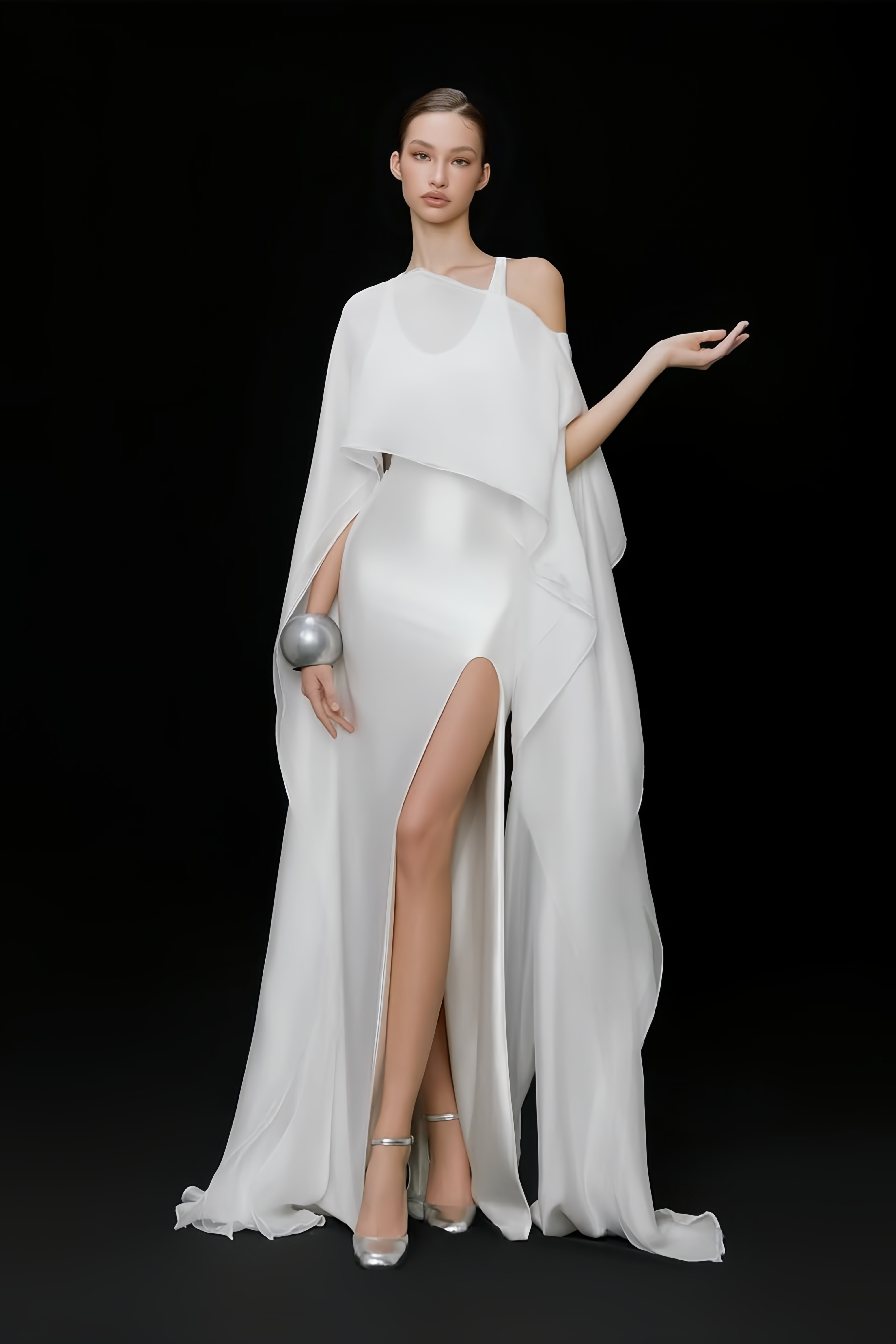 Elegant white satin gown with a matching long cape and a high leg slit
