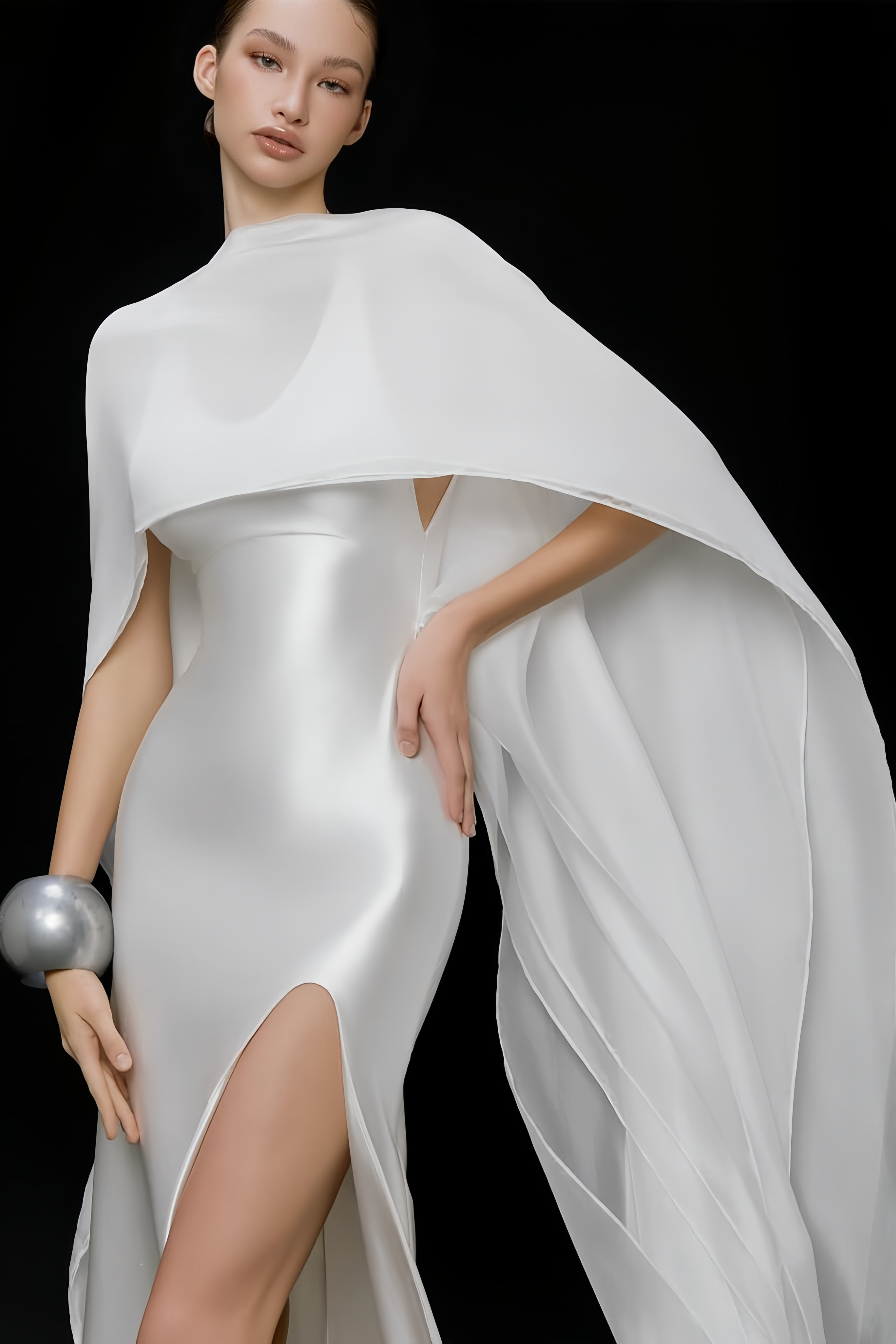 Elegant white satin gown with a matching long cape and a high leg slit