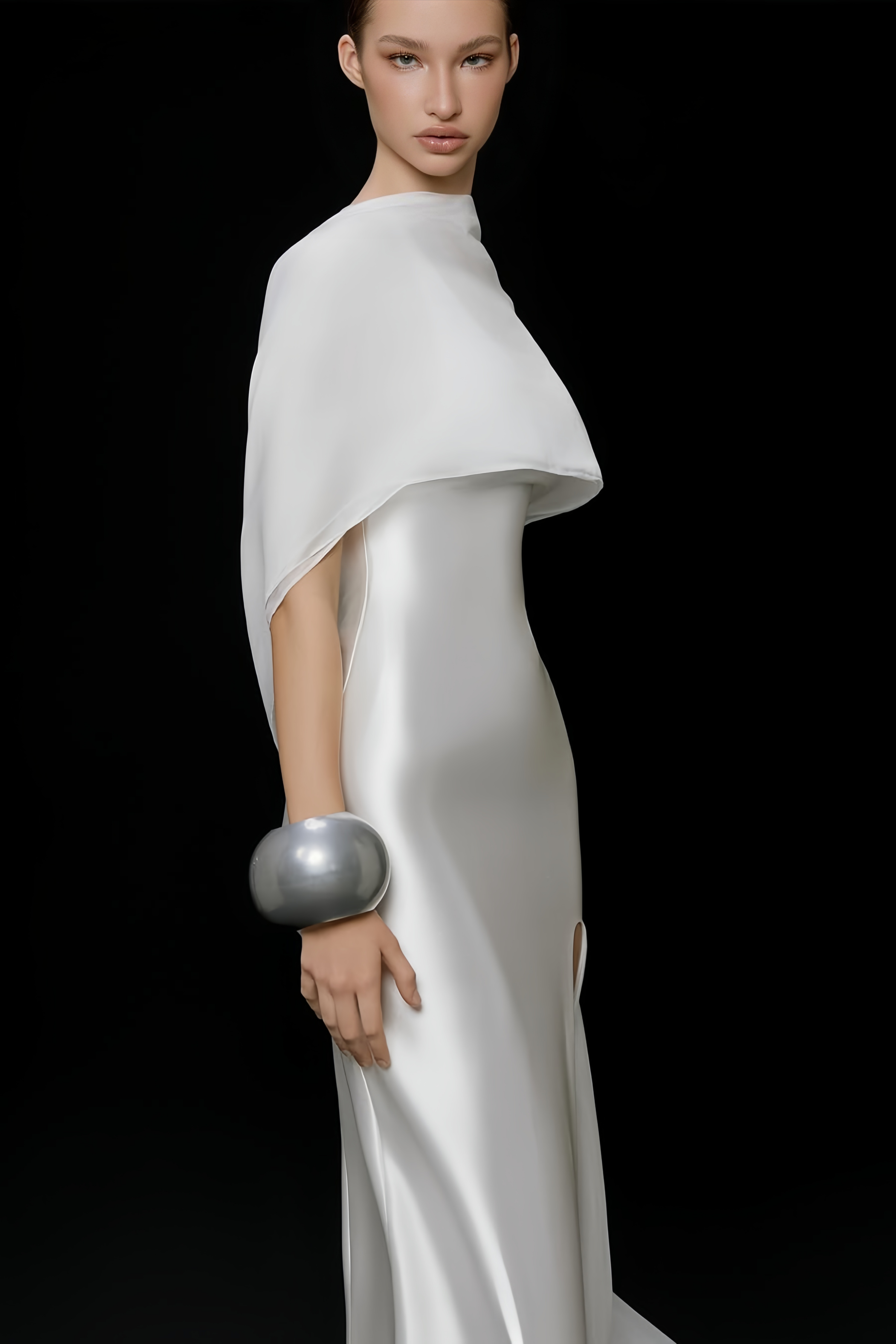 Elegant white satin gown with a matching long cape and a high leg slit