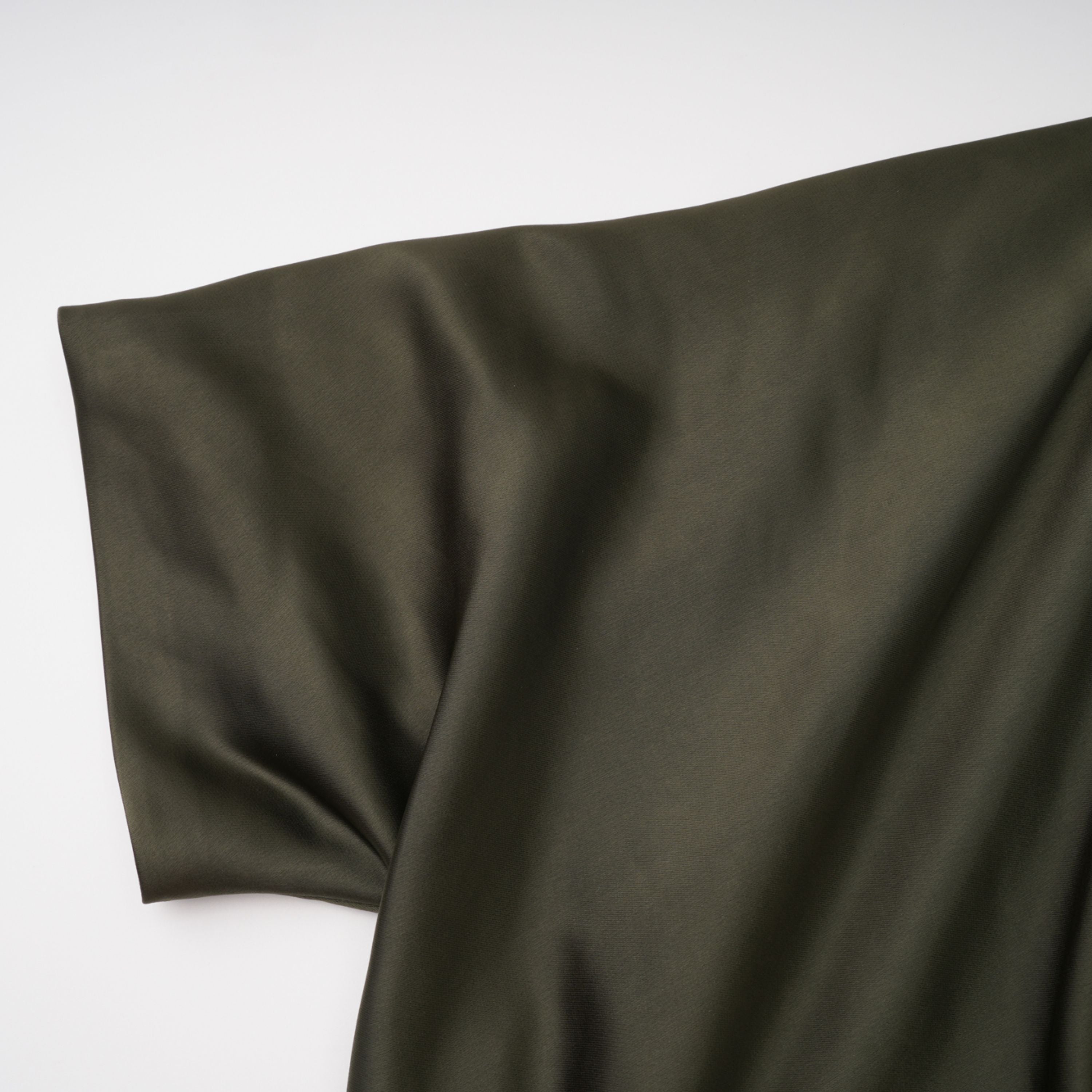 Olive green satin maxi dress with a draped one-shoulder neckline and ruched fitted skirt