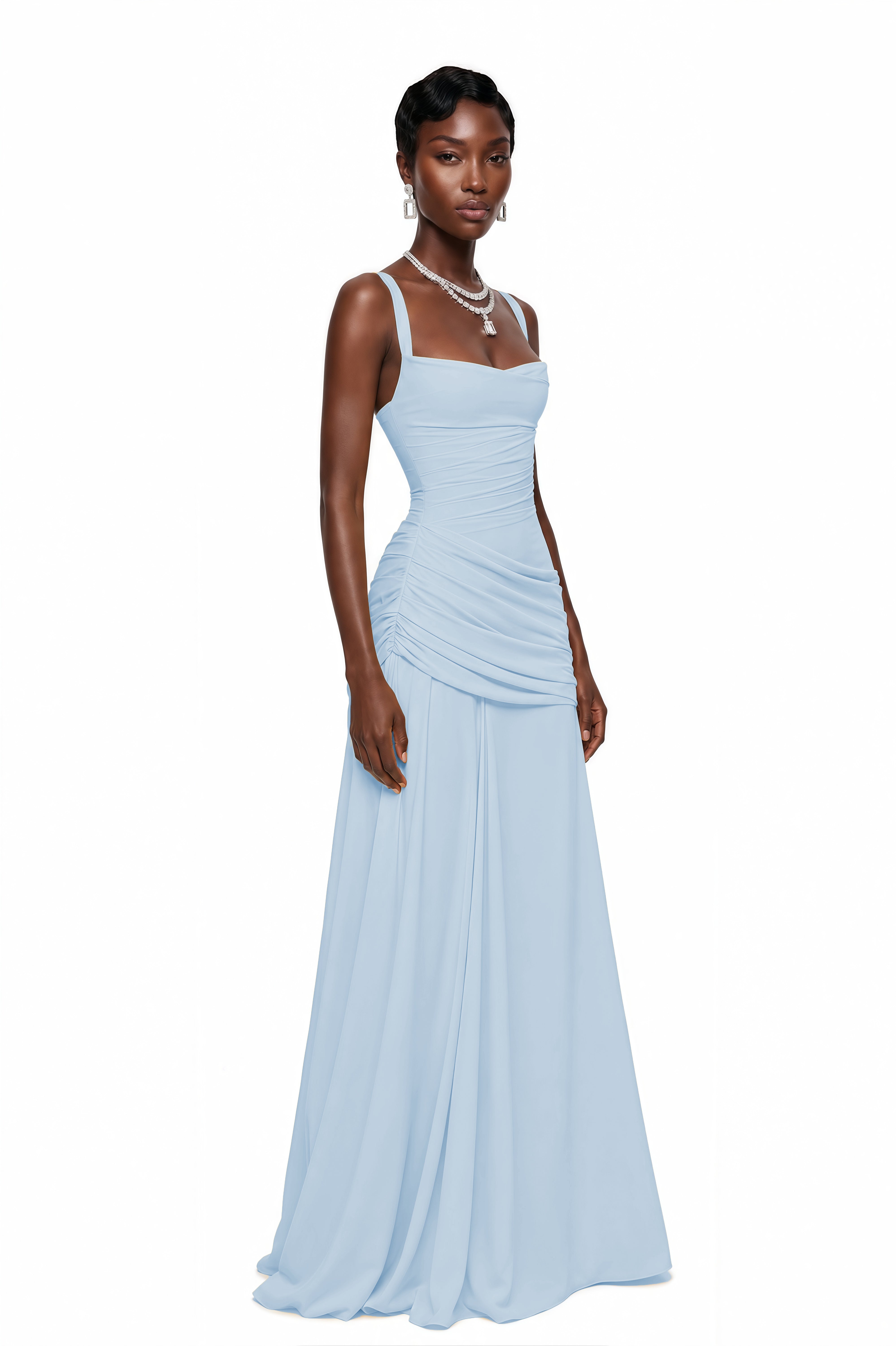 Light blue maxi dress with thick straps, a gathered corset bodice, and a draped asymmetric skirt