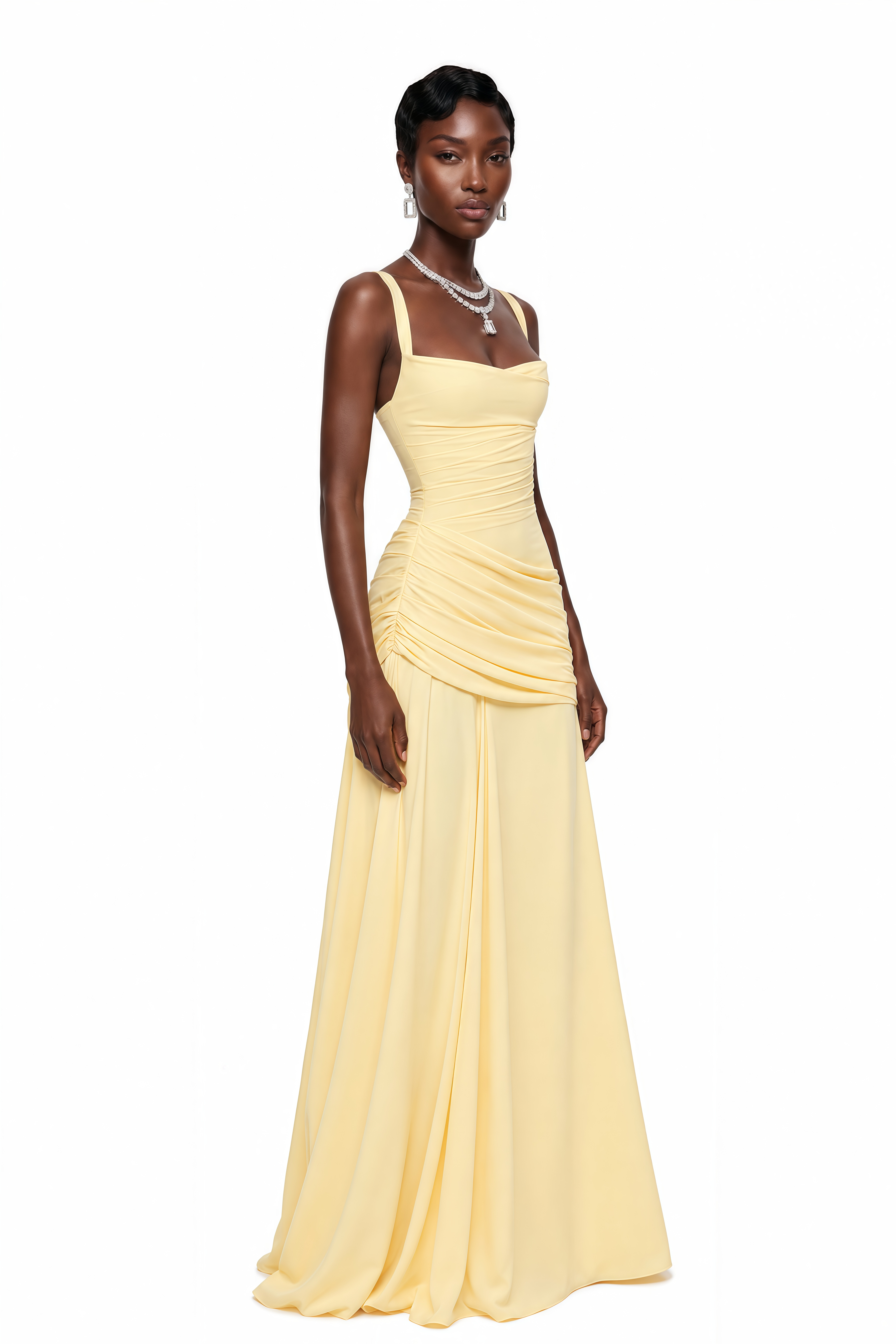 Yellow maxi dress with thick straps, a gathered corset bodice, and a draped asymmetric skirt