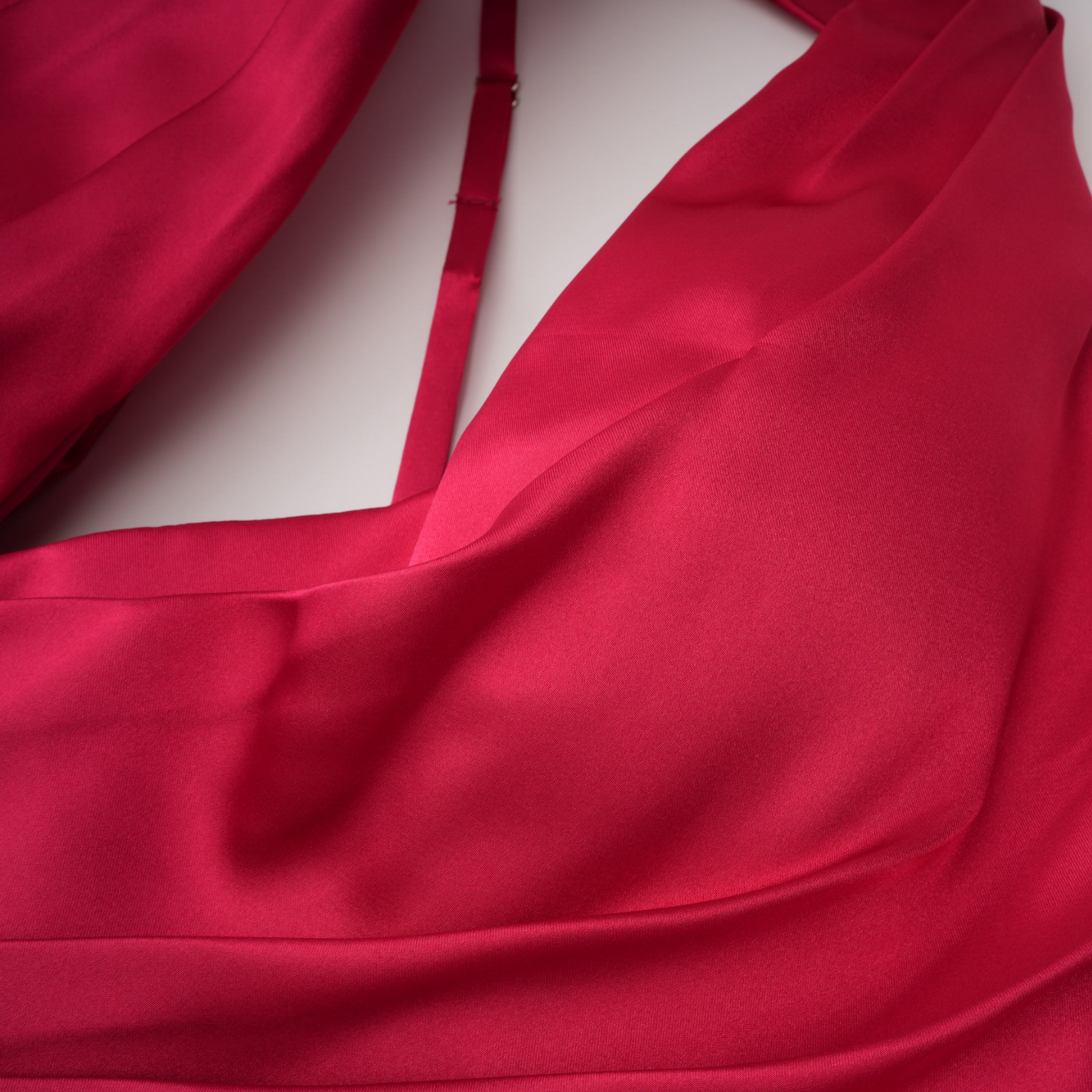 Red one-shoulder satin gown with chest cutout and draped waist