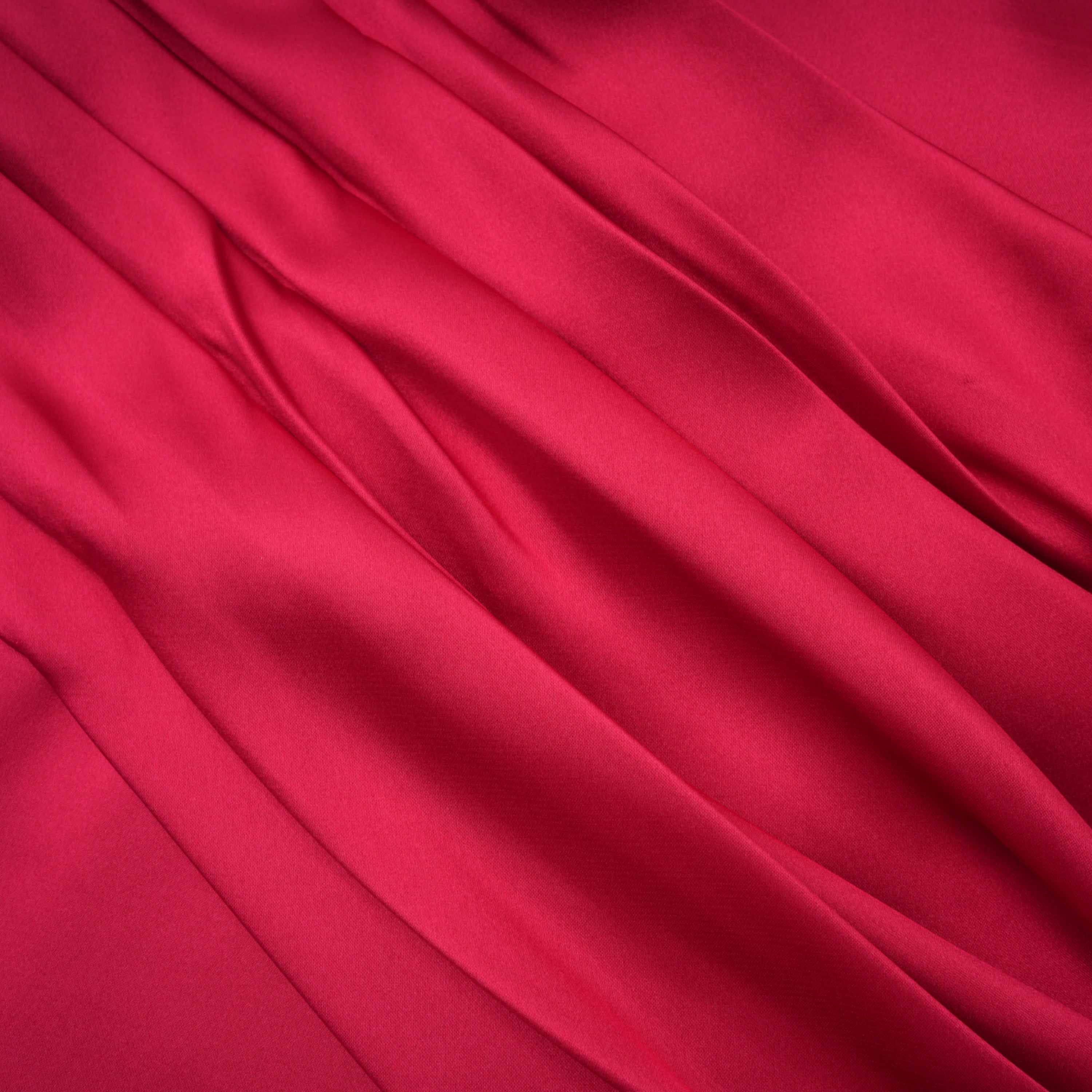 Red one-shoulder satin gown with chest cutout and draped waist