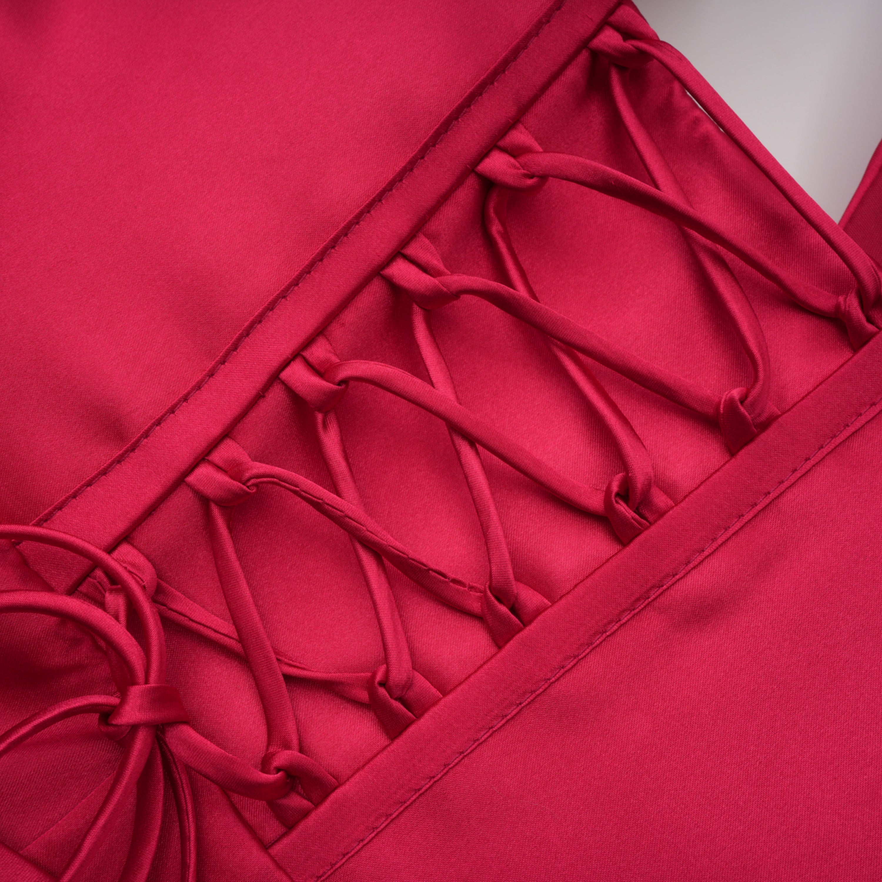 Red one-shoulder satin gown with chest cutout and draped waist