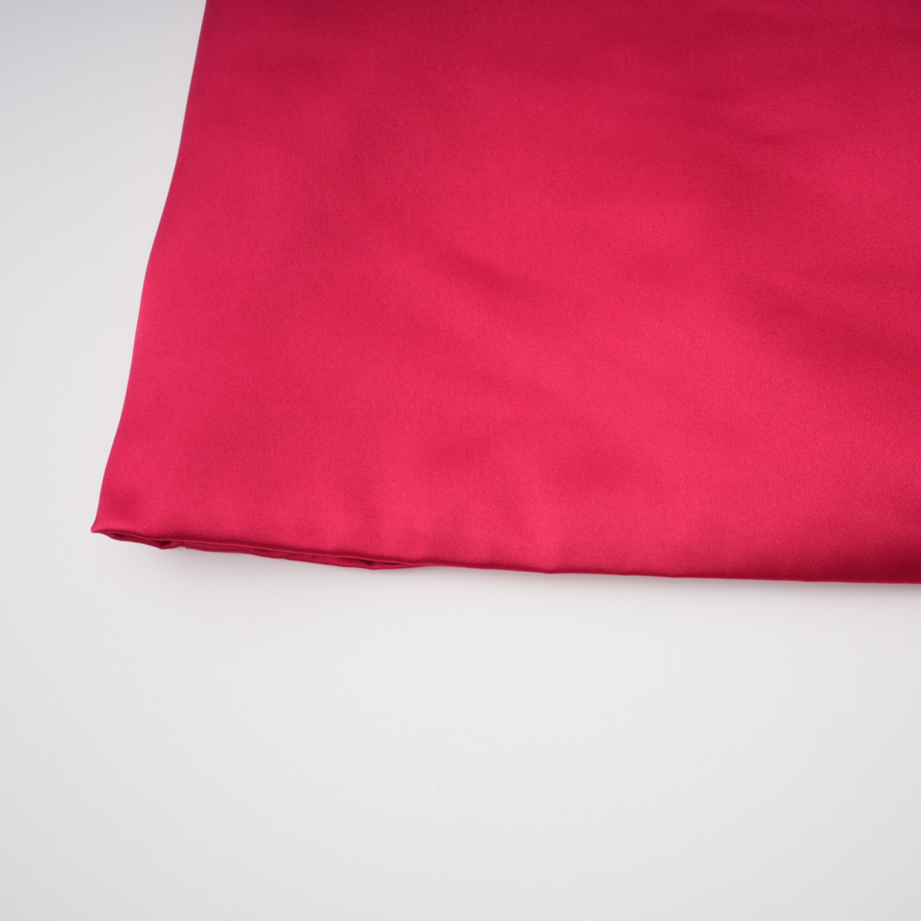 Red one-shoulder satin gown with chest cutout and draped waist
