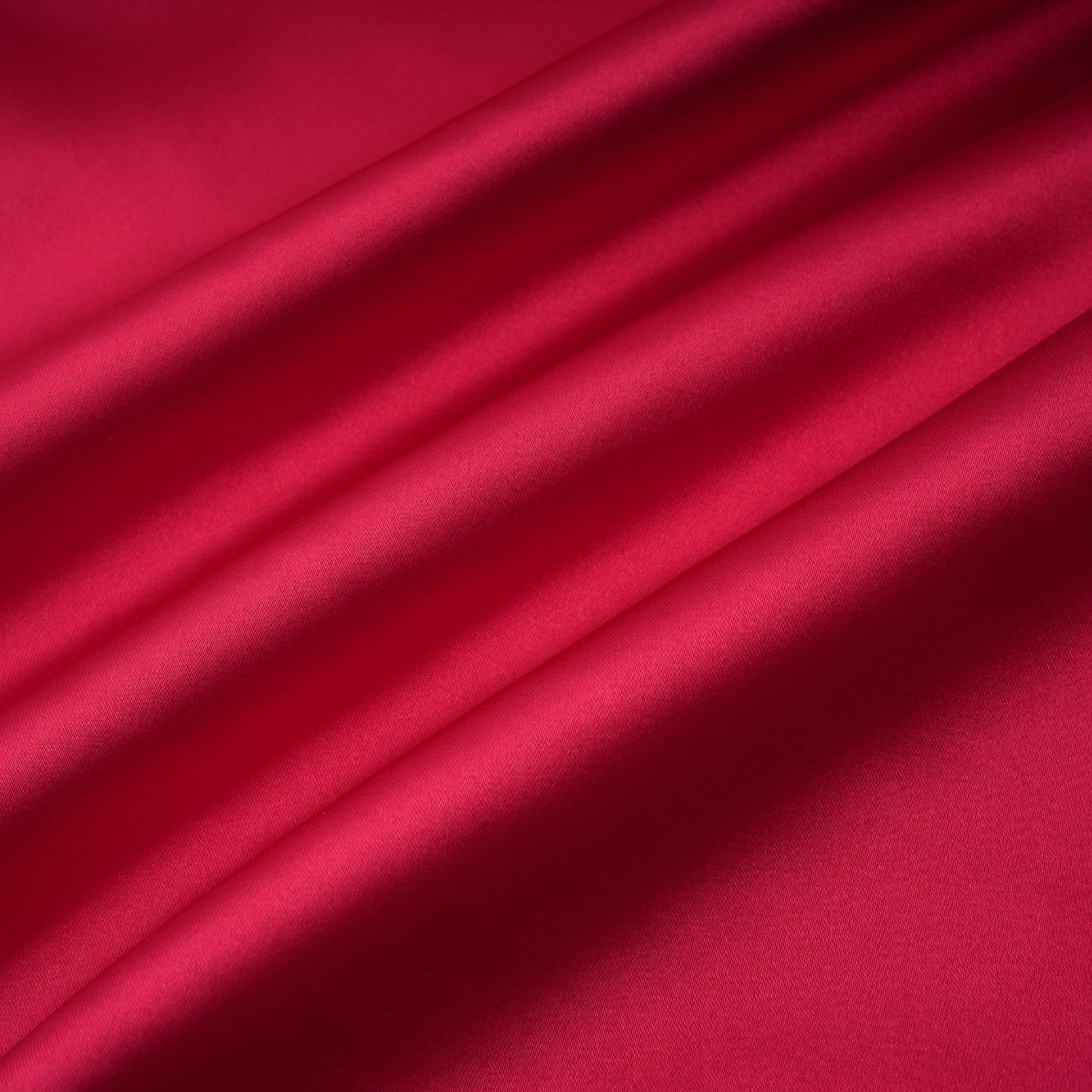 Red one-shoulder satin gown with chest cutout and draped waist