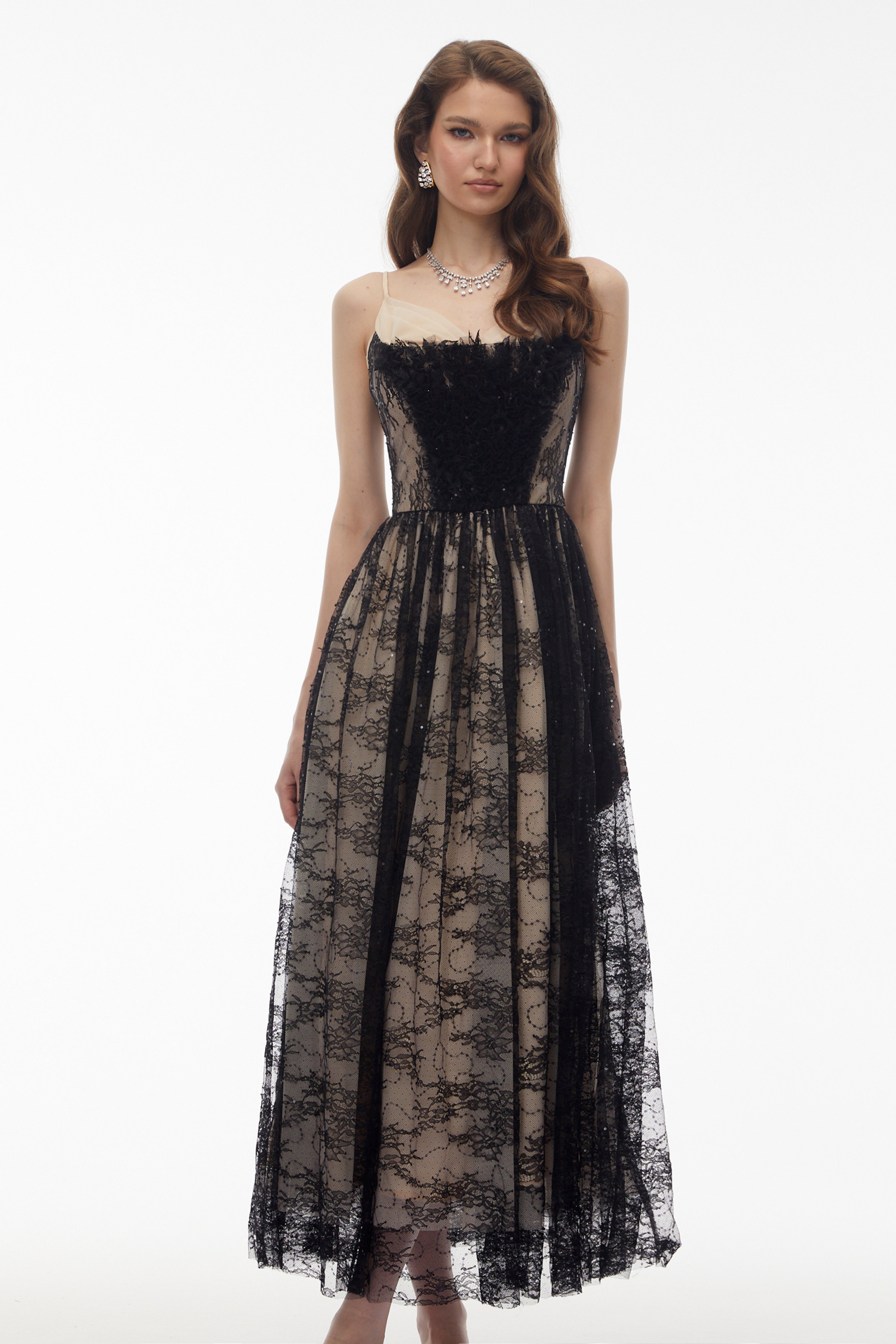 Black lace maxi dress with nude lining and feather trim