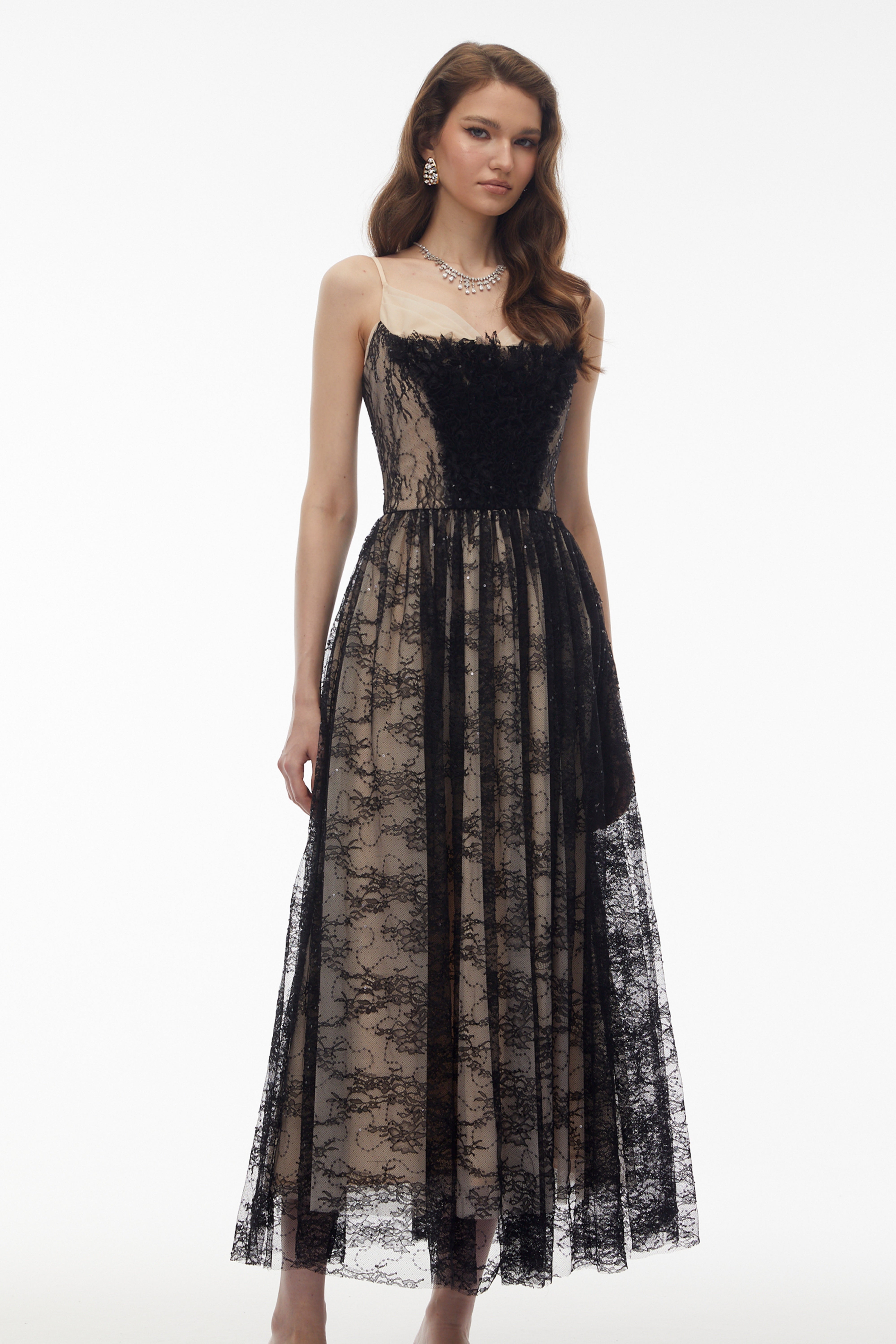 Black lace maxi dress with nude lining and feather trim