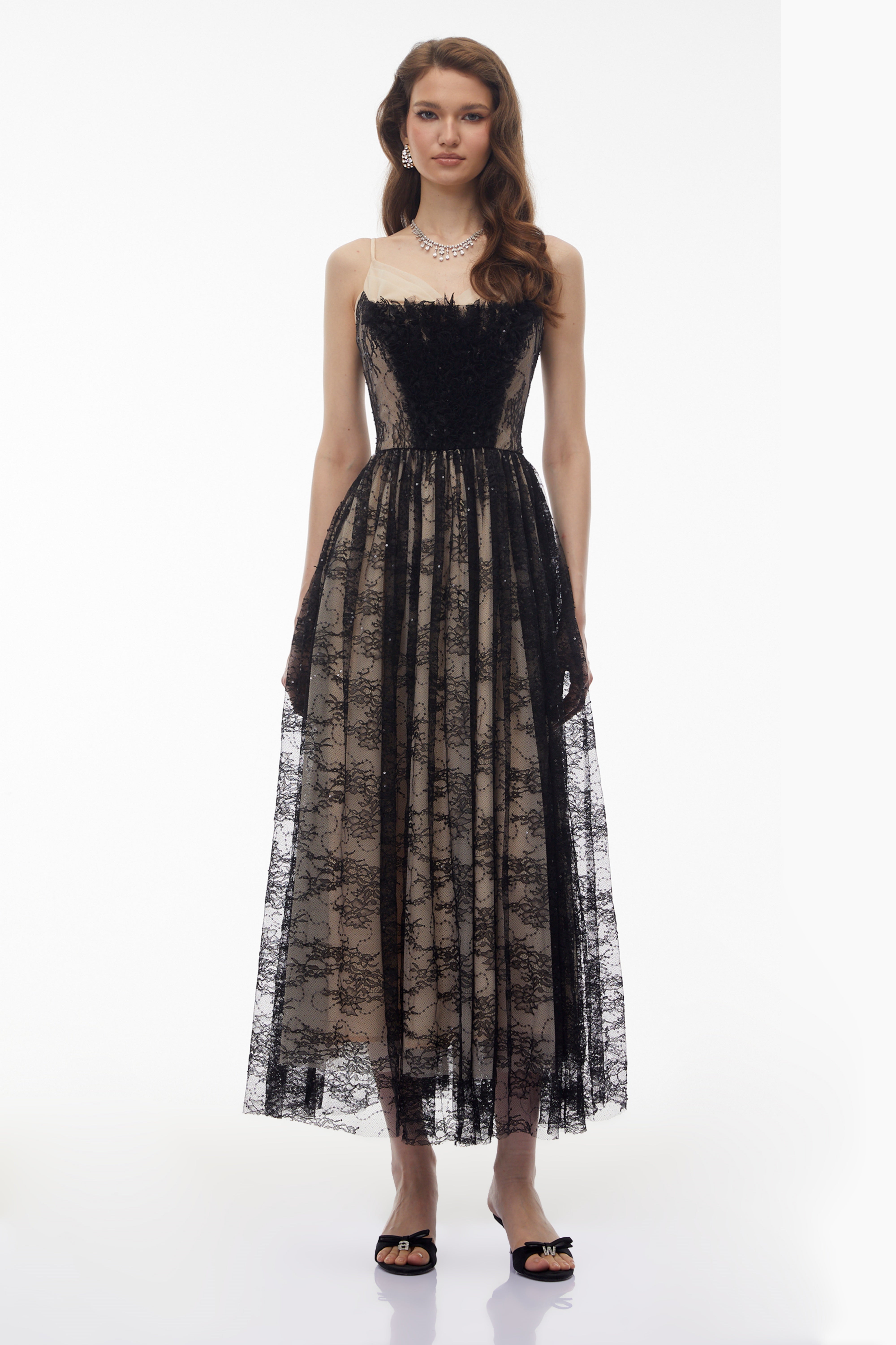 Black lace maxi dress with nude lining and feather trim